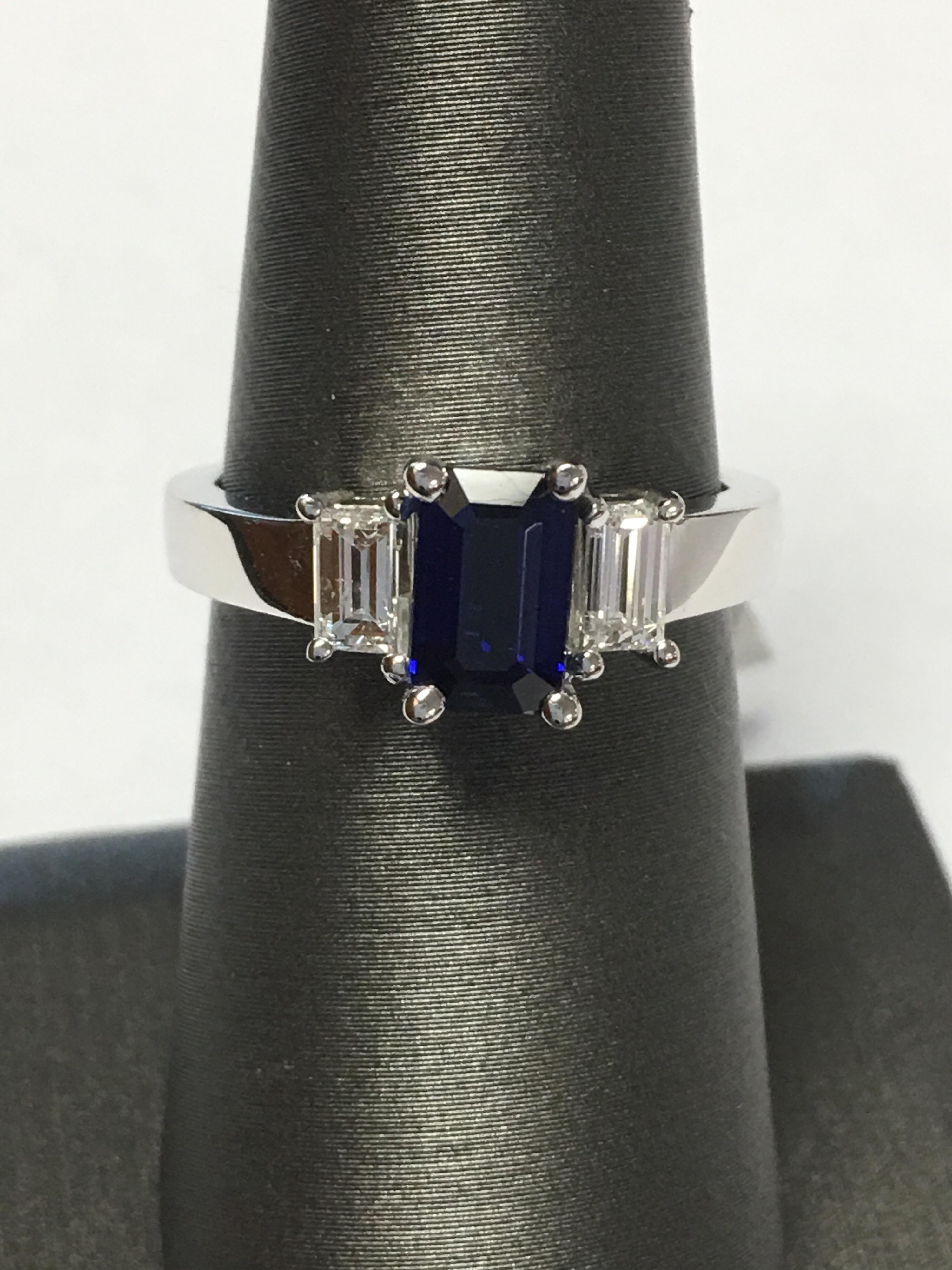 Natural emerald cut sapphire weigh 1.20 CTS and 0.50CTS Emerald cut diamonds 0.25 each set in 14K White gold. One of a kind.
