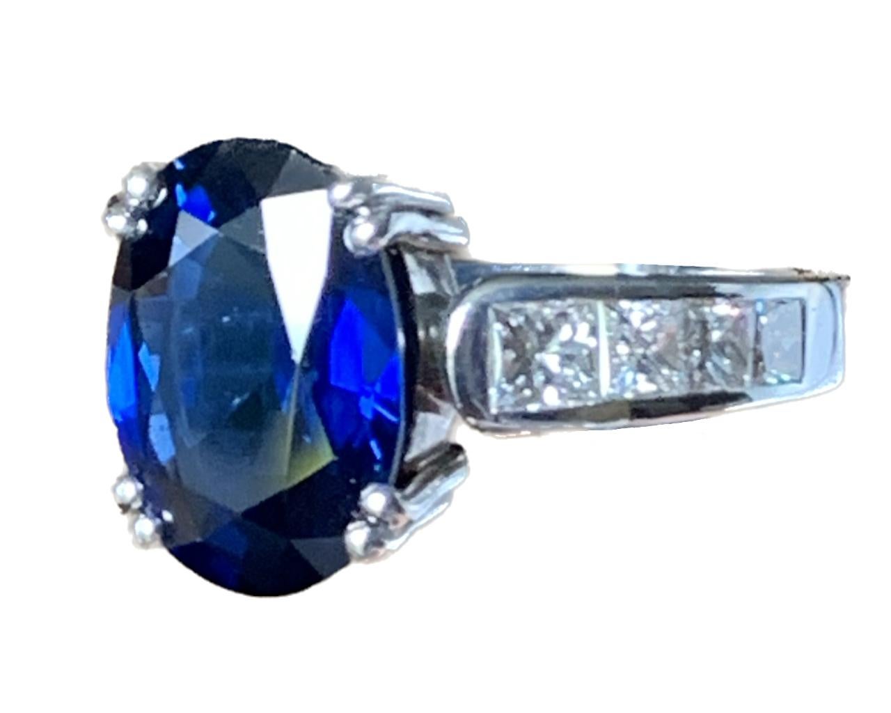 A ring with a 6.40ct. oval sapphire and 8 princess-cut diamonds weighing 1.06ct. in 18K white gold. 

Product Details
↣ Jewelry Type - Rings
↣ Style - Clasic
↣ Jewelry Main Material - 18K Yellow White

Stone Details
↣ Primary Stone Type: Sapphire
↣