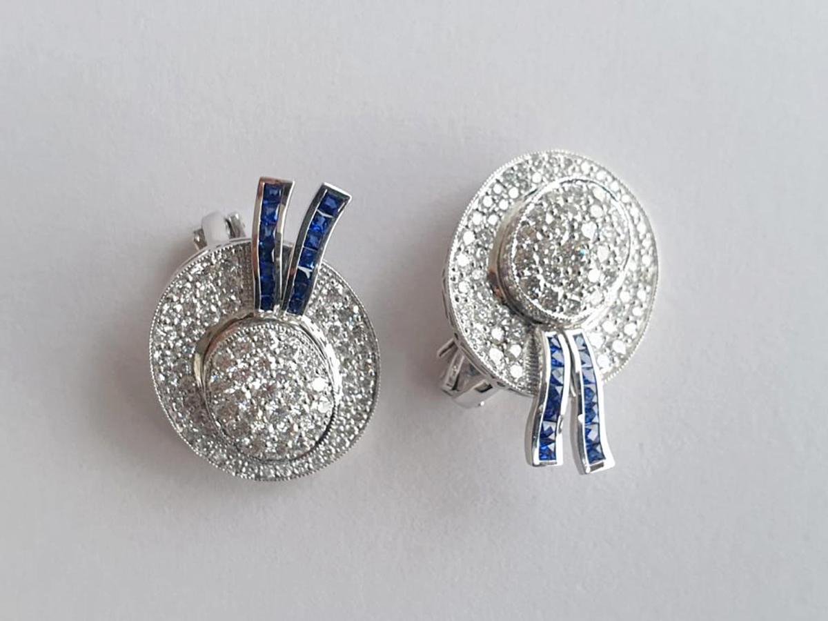 These Earring-Hat Ear clips with Sapphire and Diamonds in Platinum are a stunning piece of jewelry designed to adorn the ears of the wearer. These ear clips are made of platinum, which gives them a luxurious and durable finish. The clips are