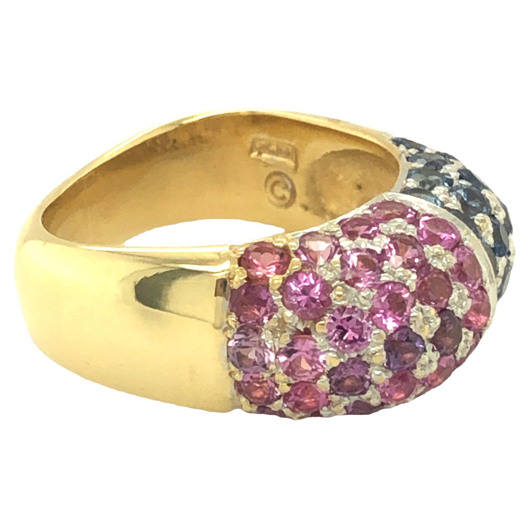 This exquisite and one-of-a-kind ring showcases a harmonious blend of round-cut sapphire and pink sapphire, with a combined weight of approximately 3.60 carats. The ring features a comfortable, rounded-square band and is meticulously crafted in 18K