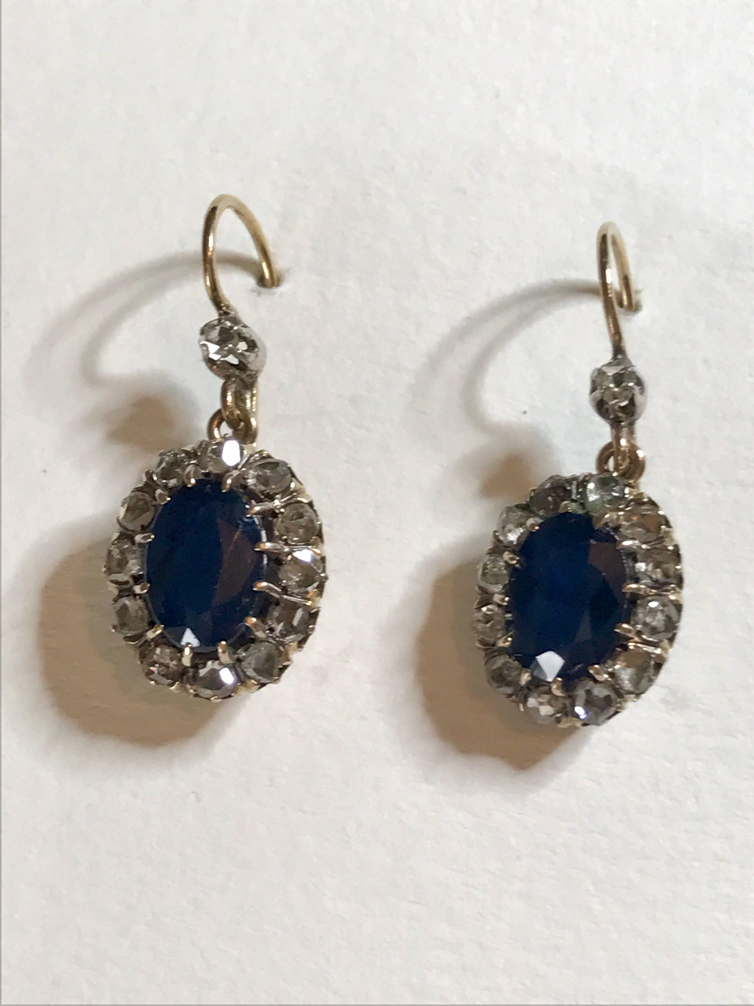 A pair of natural blue sapphire and rose cut diamond earrings