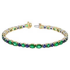 Pulsera de zafiro y granate tsavorita en oro blanco y amarillo