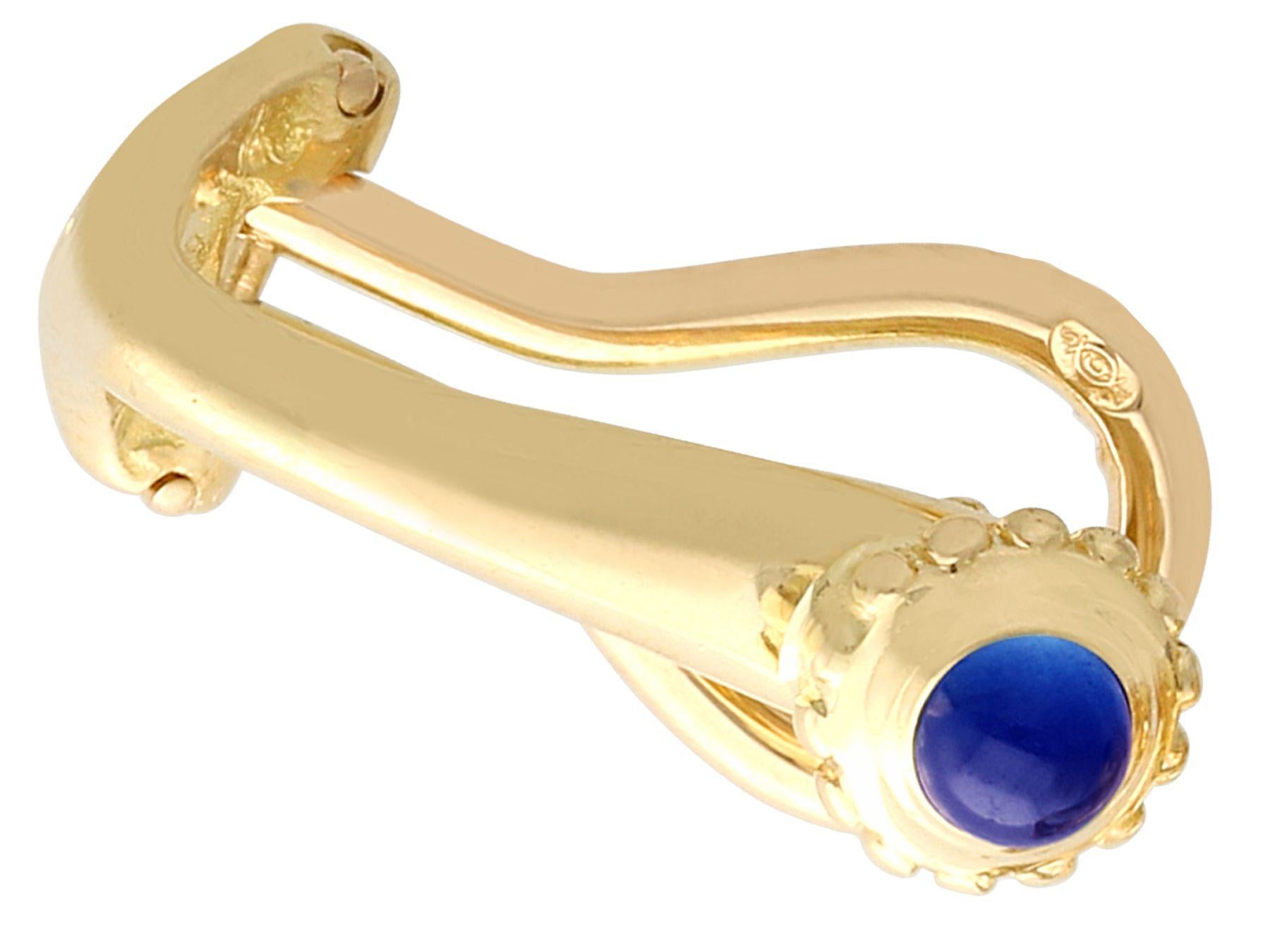 A fine and impressive pair of vintage 0.16 carat sapphire, 18 karat yellow gold earrings, made by Cartier; part of our diverse sapphire jewelry collections.

These fine and impressive vintage cabochon cut sapphire earrings have been crafted in 18k