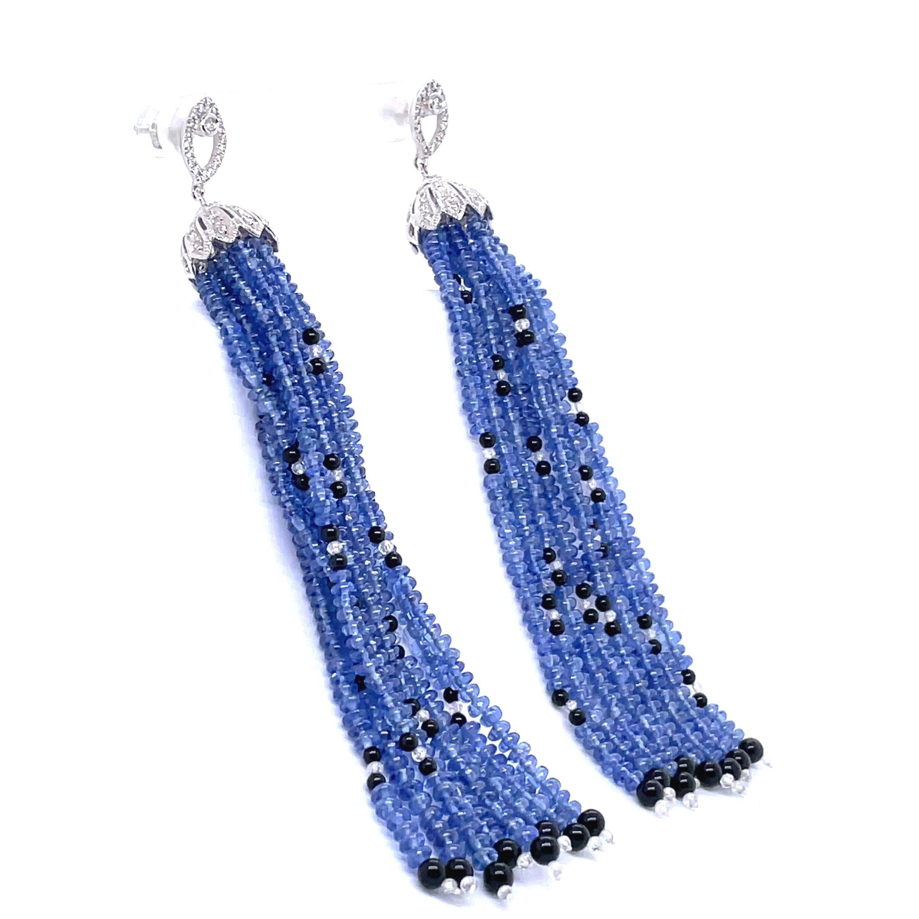 A striking statement piece for any occasion.

These carefully crafted earrings have 79.34 carats of brilliant sapphire beads sourced from Burma with no-heat treatment. 

Resembling grapes, each earring is adorned with 80 black onyx beads and 48