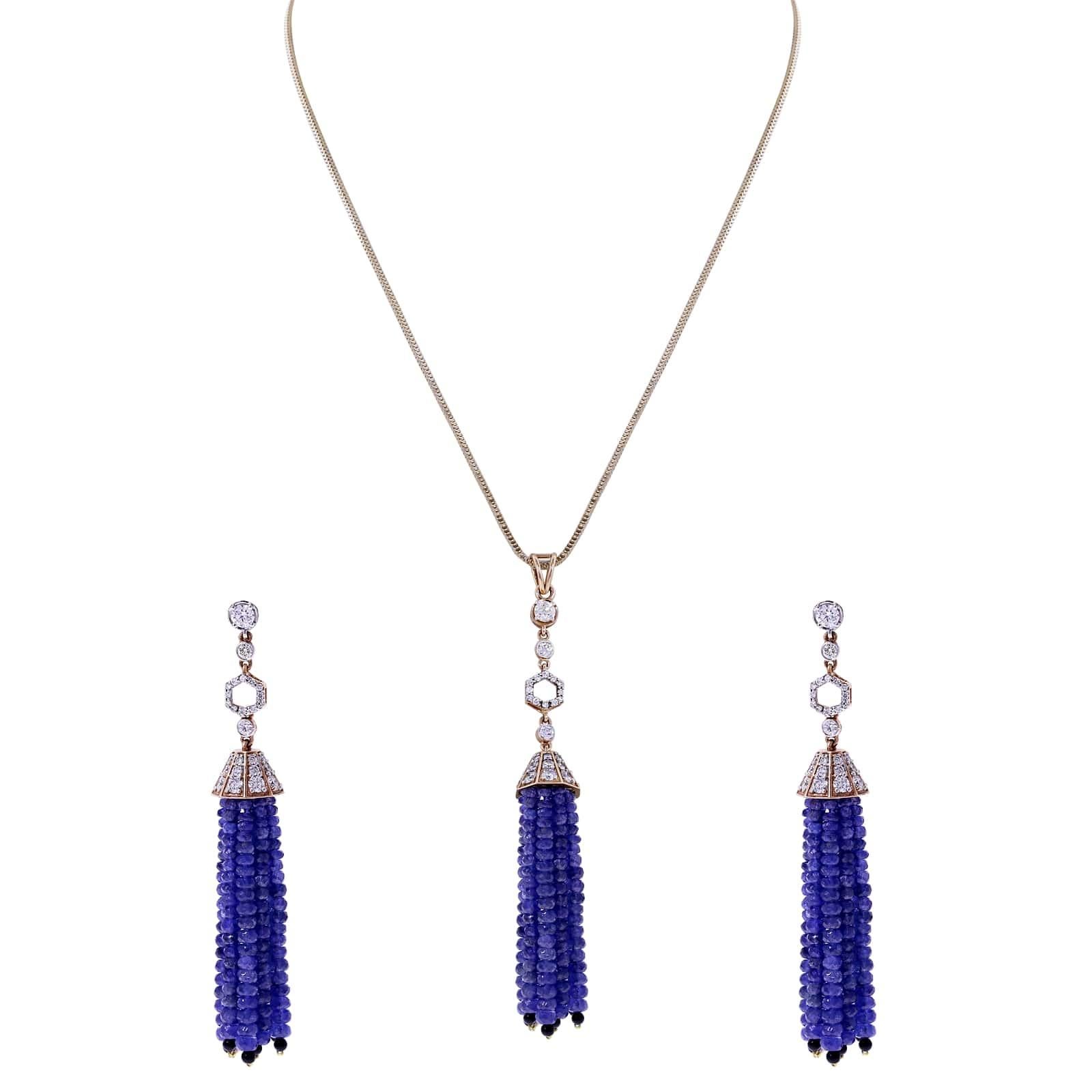 A Faceted Sapphire Bead Tassel Pendant with Diamonds and Onyx. There are 47.24 cts. of Sapphires, 1.31 ct. Onyx, and 1.90 cts. of Diamonds. The total weight of the pendant is 14.38 grams. 