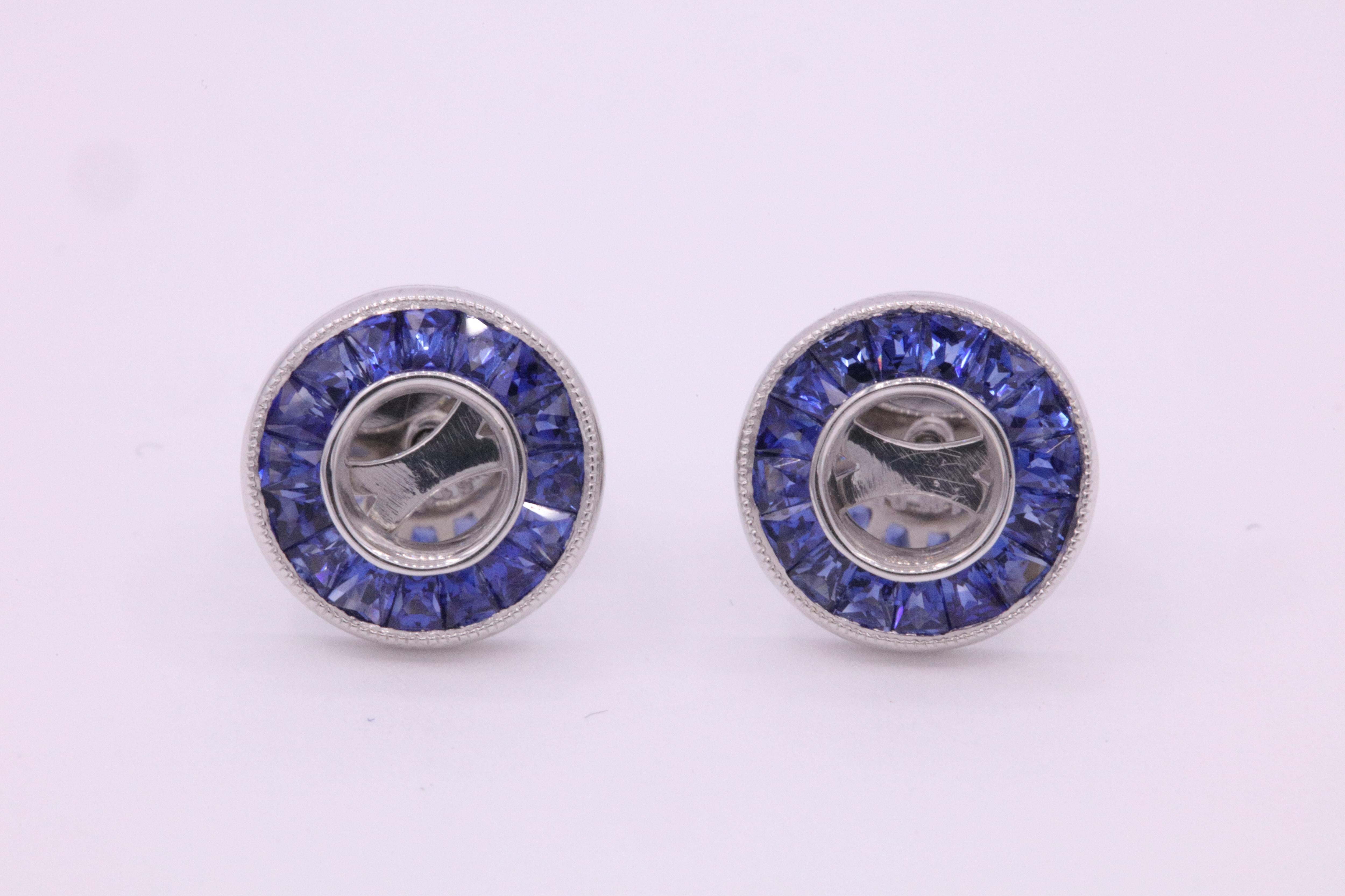 Blue sapphire bezel set earring mountings weighing 1.19 carats crafted in platinum. 

Harbor Diamonds can mount your own diamonds or gemstone.