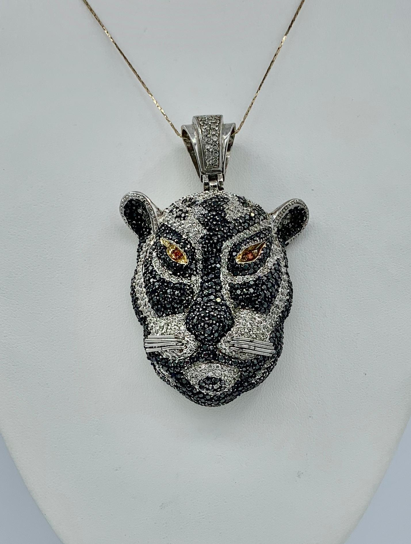 This is a magnificent Black Panther Leopard Lion Pendant set throughout with Black Sapphire, White Sapphire and two Orange Sapphire Eyes.   The sapphires are set in silver.  The pendant is a fabulous large size, 3 inches tall (7.5 cm) and 2 inches