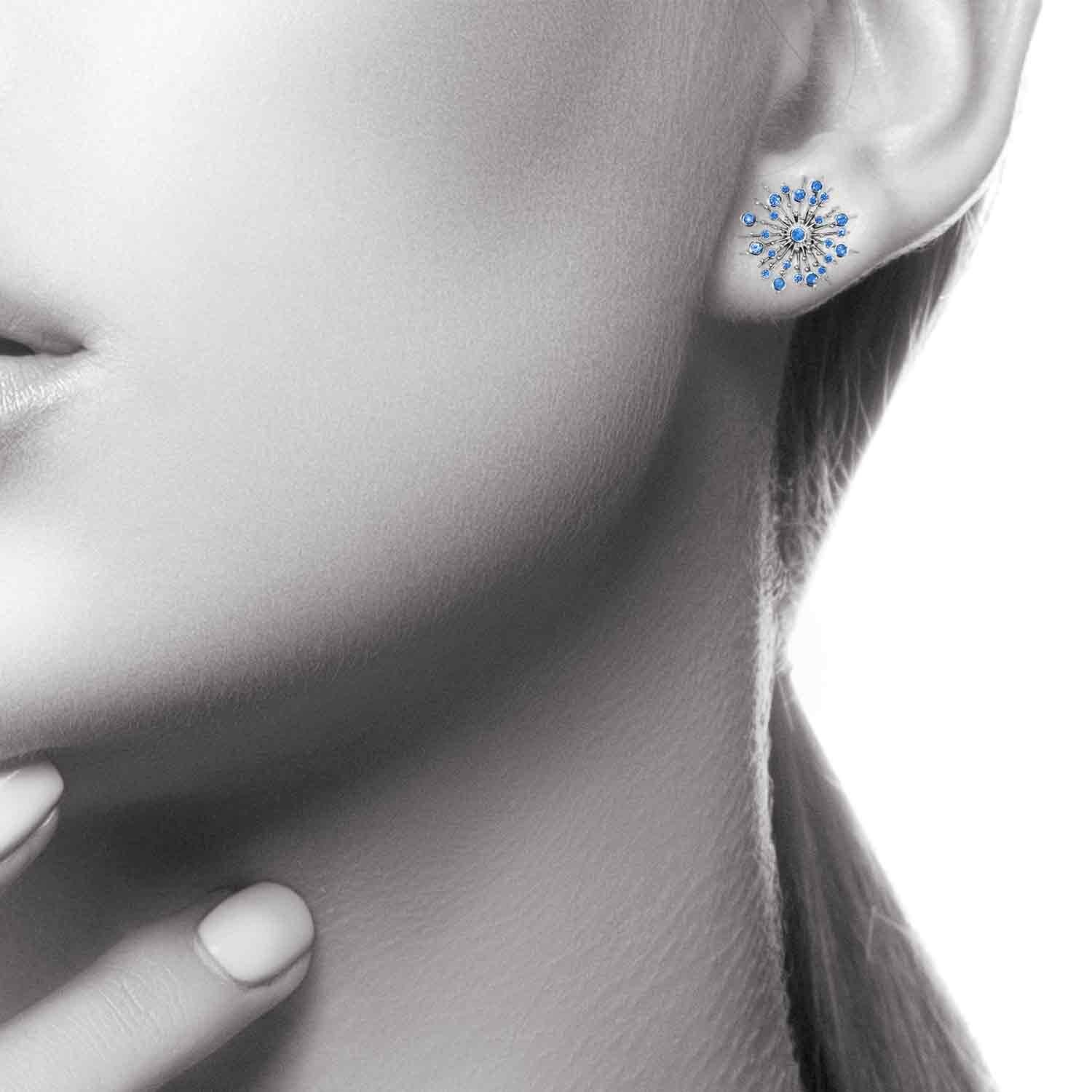 Part of the 'Soleil' collection by Natalie Barney, these stud earrings feature 48 Blue Sapphires with a total weight of 0.44 carats. The matching pendant is available.

Made in 9 carat white gold.  Please request the video for an even closer view of