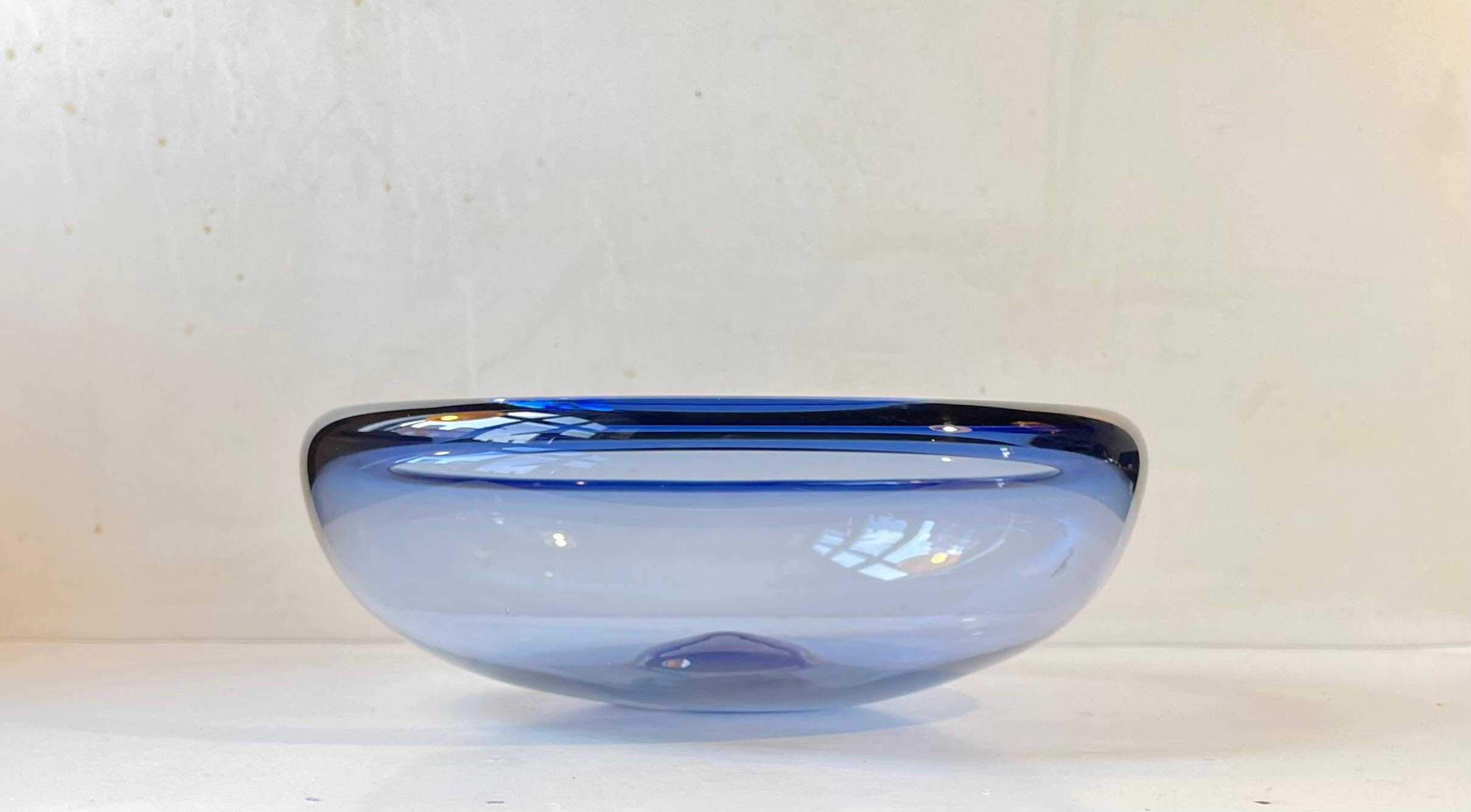 Handblown sapphire blue bowl designed by Per Lütken in 1955. This piece was manufactured at Holmegaard in Denmark during the Mid-late 1960s. It is called Saphire Blue Provence and it is hand signed and numbered by the designer. Measurements: D: 27