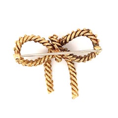 Sapphire Bow 18k Yellow Gold Brooch by Tiffany & Co., circa 1970s