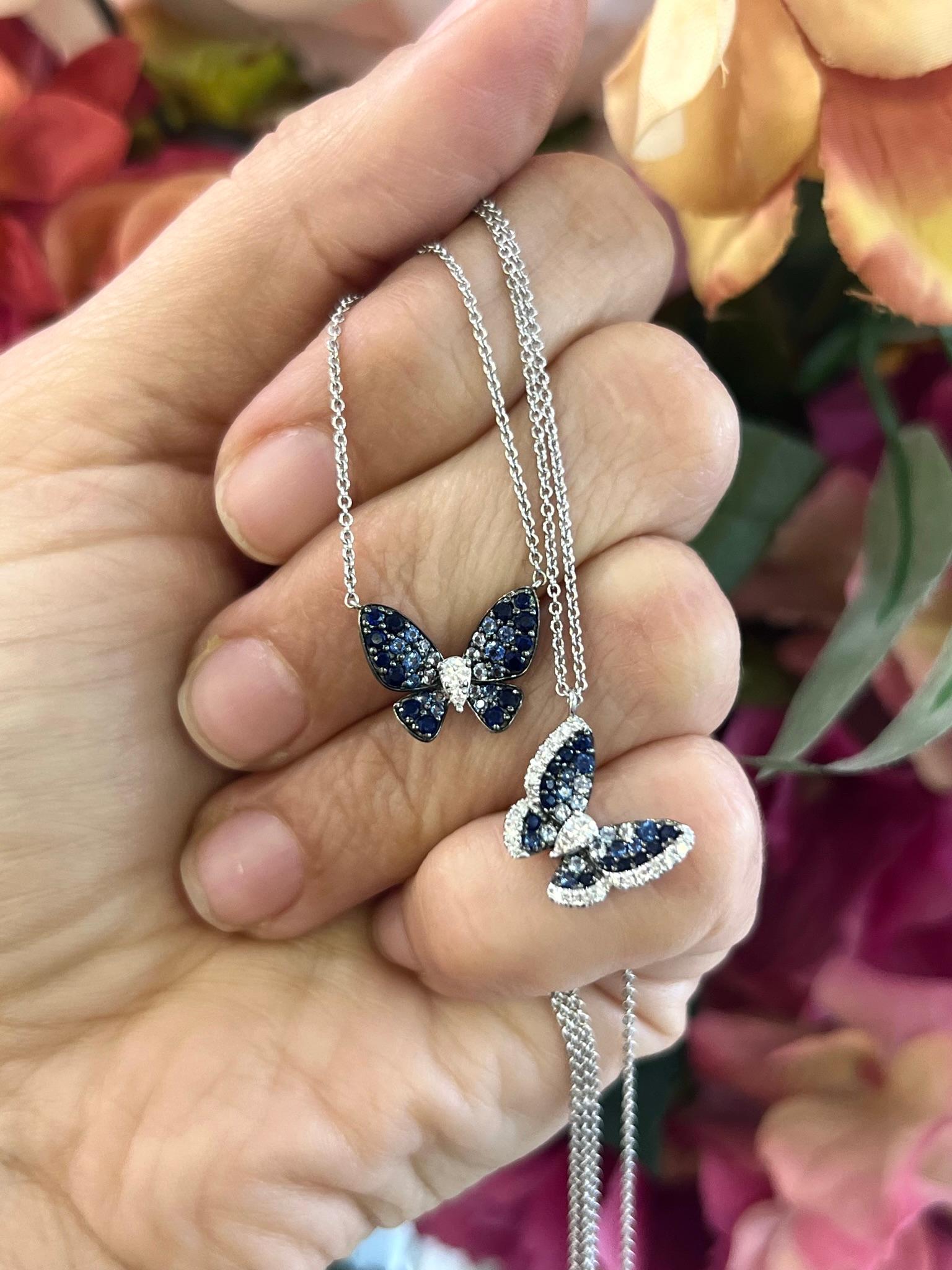 14K white gold sapphire and diamond butterfly pendant necklace.

This elegant pendant necklace features a unique butterfly shape and a stunning ombre effect of sapphires ranging from dark to lighter blue. Crafted with genuine sapphires, this