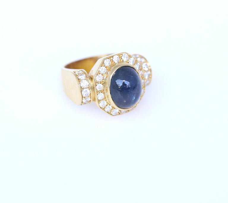 Fine Sapphire Cabochon Diamonds Yellow Gold Ring. An amazing example of the 1970-es style, bright yellow gold and fine shiny Diamonds. Perfect for any jewelry collection and a fine ring to be worn with pride. 
The geometrical design reminds the Art