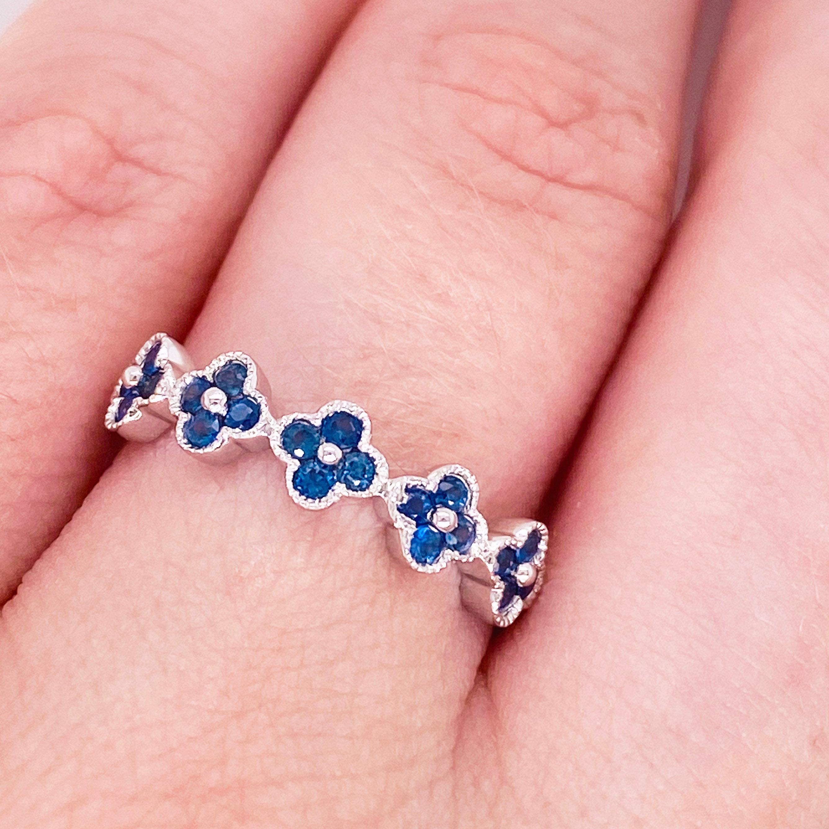 These stunning flowers fashioned out of 22 rich blue sapphires set in polished 14k white gold provide a look that is very classic and modern at the same time! This ring is very fashionable and can add a touch of style to any outfit, yet it is also