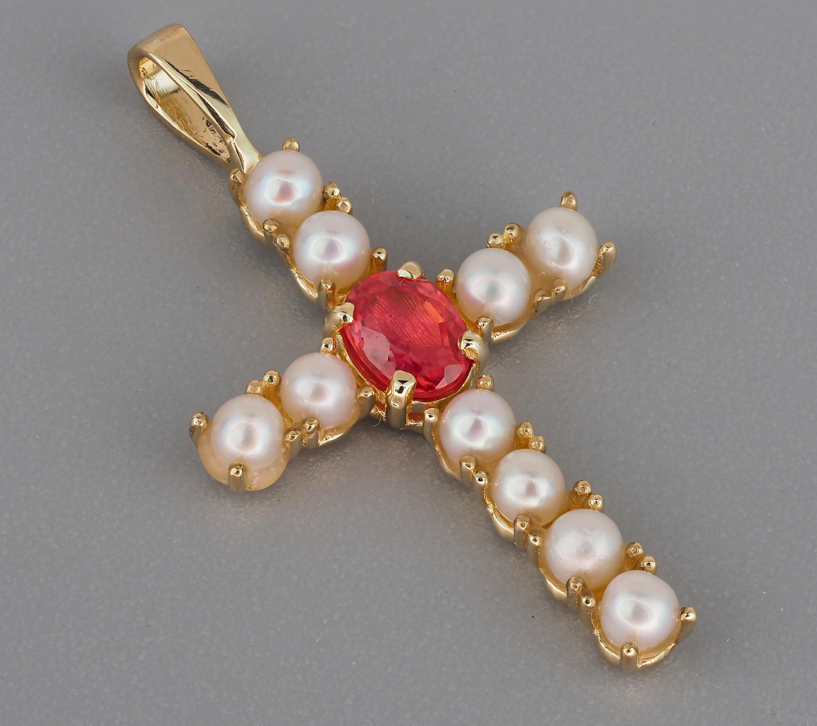 Gold cross pendant with sapphire and pearls. Sapphire cross pendant in 14k gold. Sapphire and pearls gold cross. Christmas gift for her
Weight: 1.2 g.
Gold - 14k gold 
Size: 24.5x13 mm
Stones:
Set with sapphire, color - orange pink
oval cut, 0,4