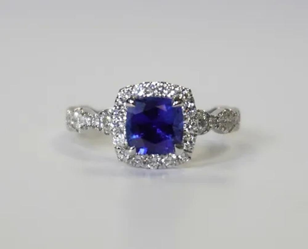 Sapphire Weight: 1.56 ct, Measurements: 6x6 mm, Diamond Weight: 0.86 ct, Metal: 18K White Gold Gold, Gold Weight: 3.71 gm, Ring Size: 6.5, Shape: Cushion, Color: Blue, Hardness: 9, Birthstone: September