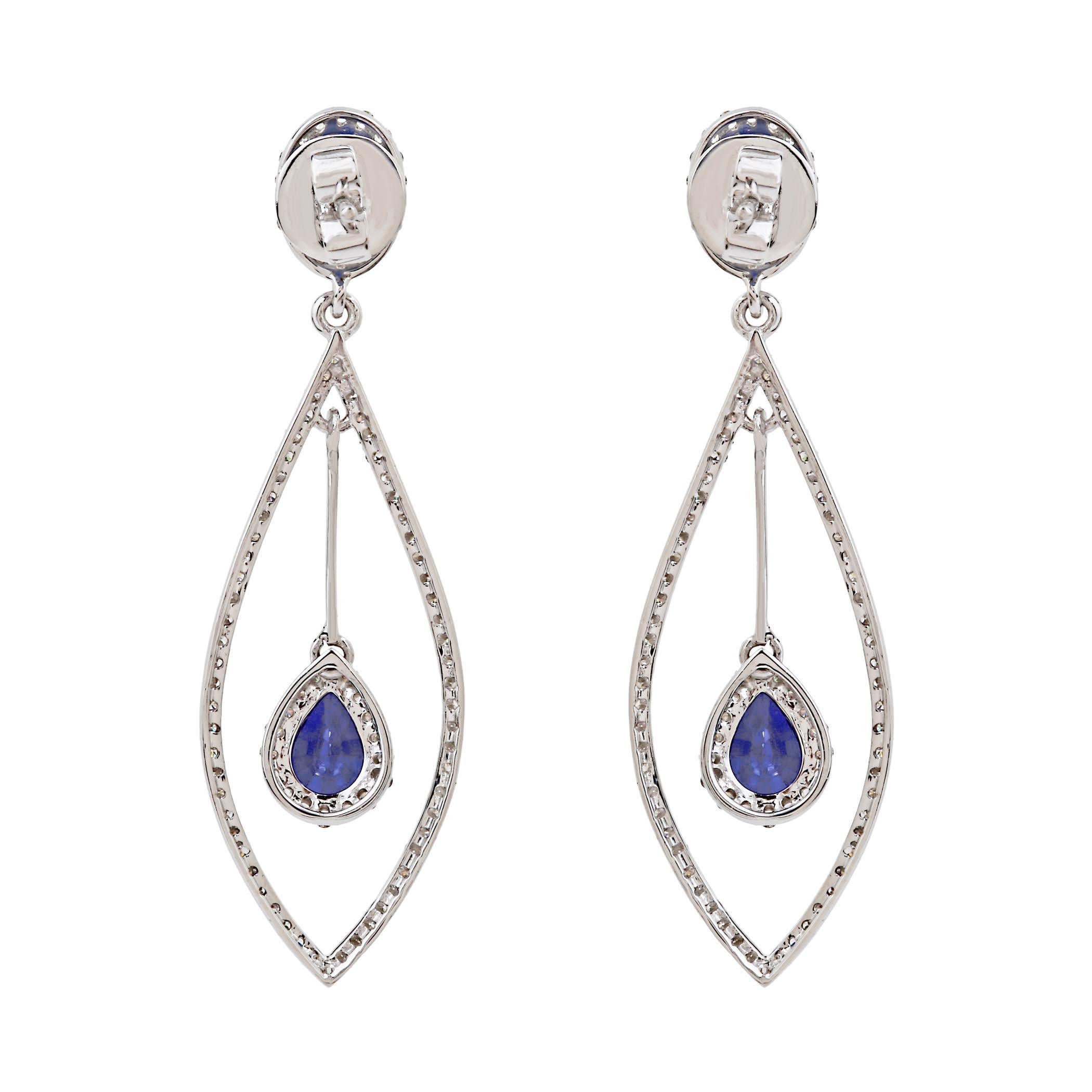 Get ready to spellbind in these exceptionally beautiful dangle earrings. Expertly crafted with sapphire and diamonds, this timeless design is set in 18K white gold. The brilliant blue hue will add vibrant color to any