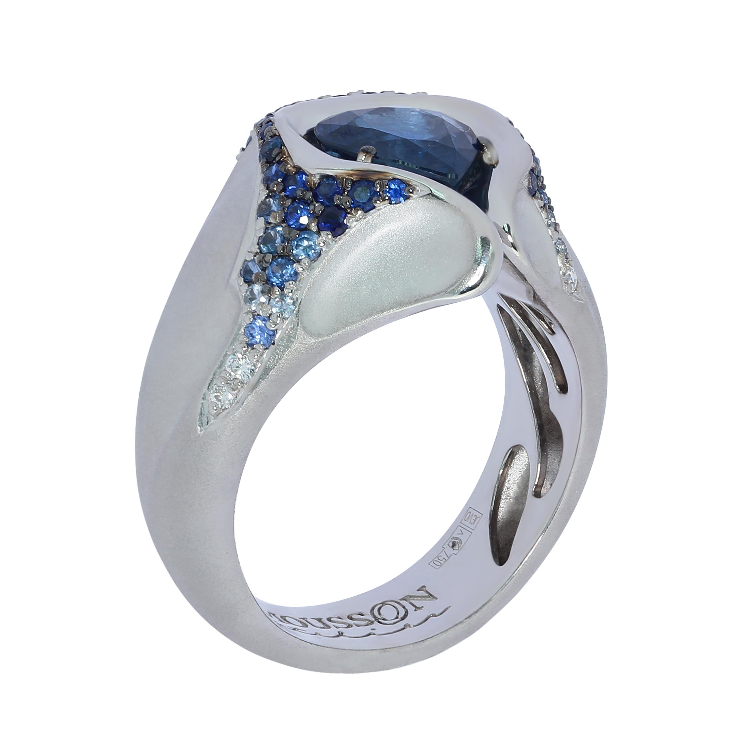 Sapphire Diamond 18 Karat White Gold HeartBeat Ring
White 18K matte Gold looks like a rock cracked from strong blows, through which a Blue heart-shaped 2.05 Carat Sapphire makes its way out. From the central stone there are cracks in which is