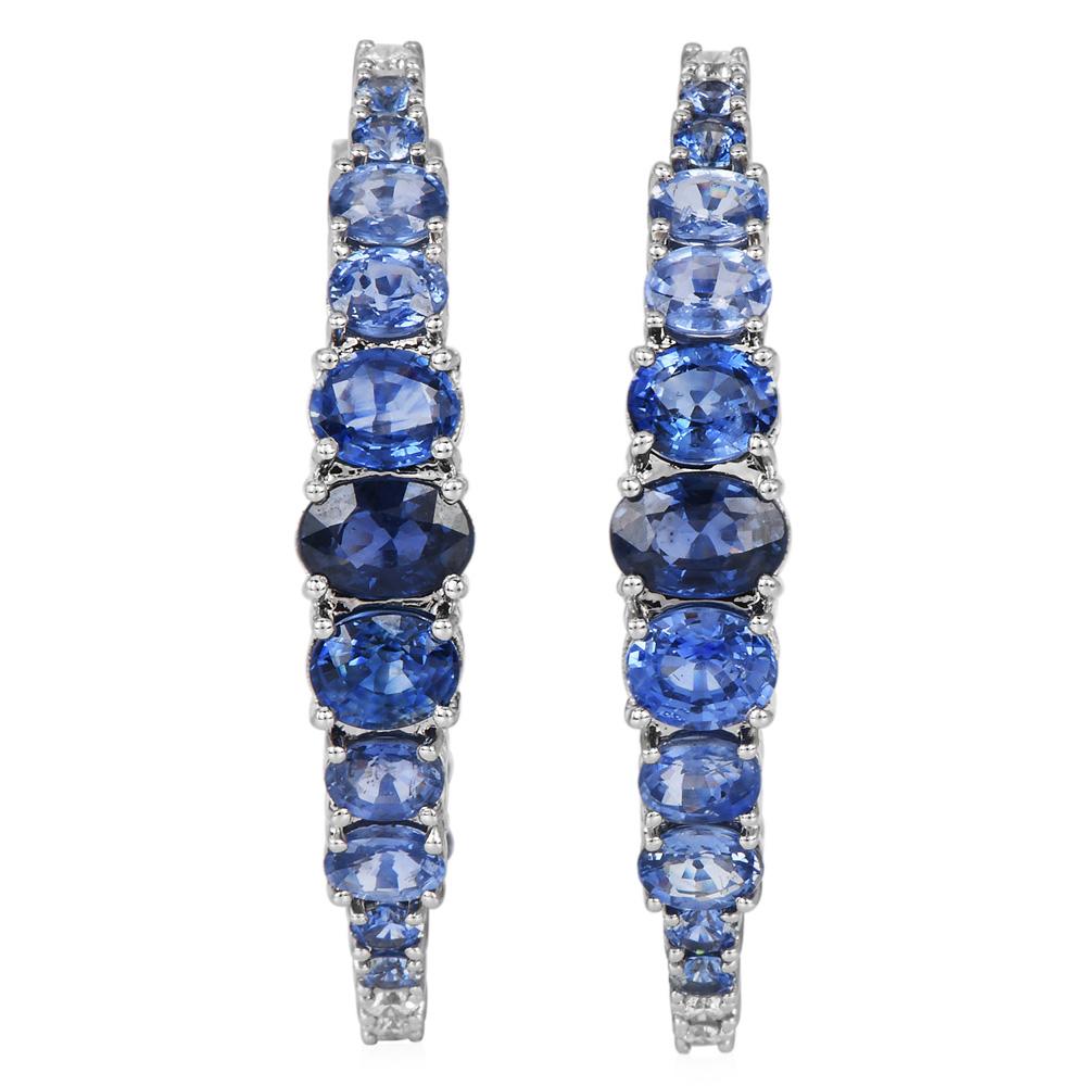 Ombre Blue Sapphire and Diamond Hoop Earrings in 18K White Gold

These earrings offer a striking design, featuring a gradient of sapphires in varying shades of blue, complemented by sparkling diamond accents.

Crafted in 18K white gold with