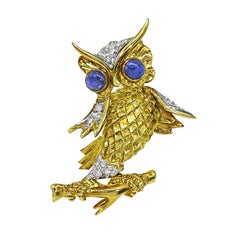 Épingle au hibou en or jaune et blanc 18k avec saphir et diamant