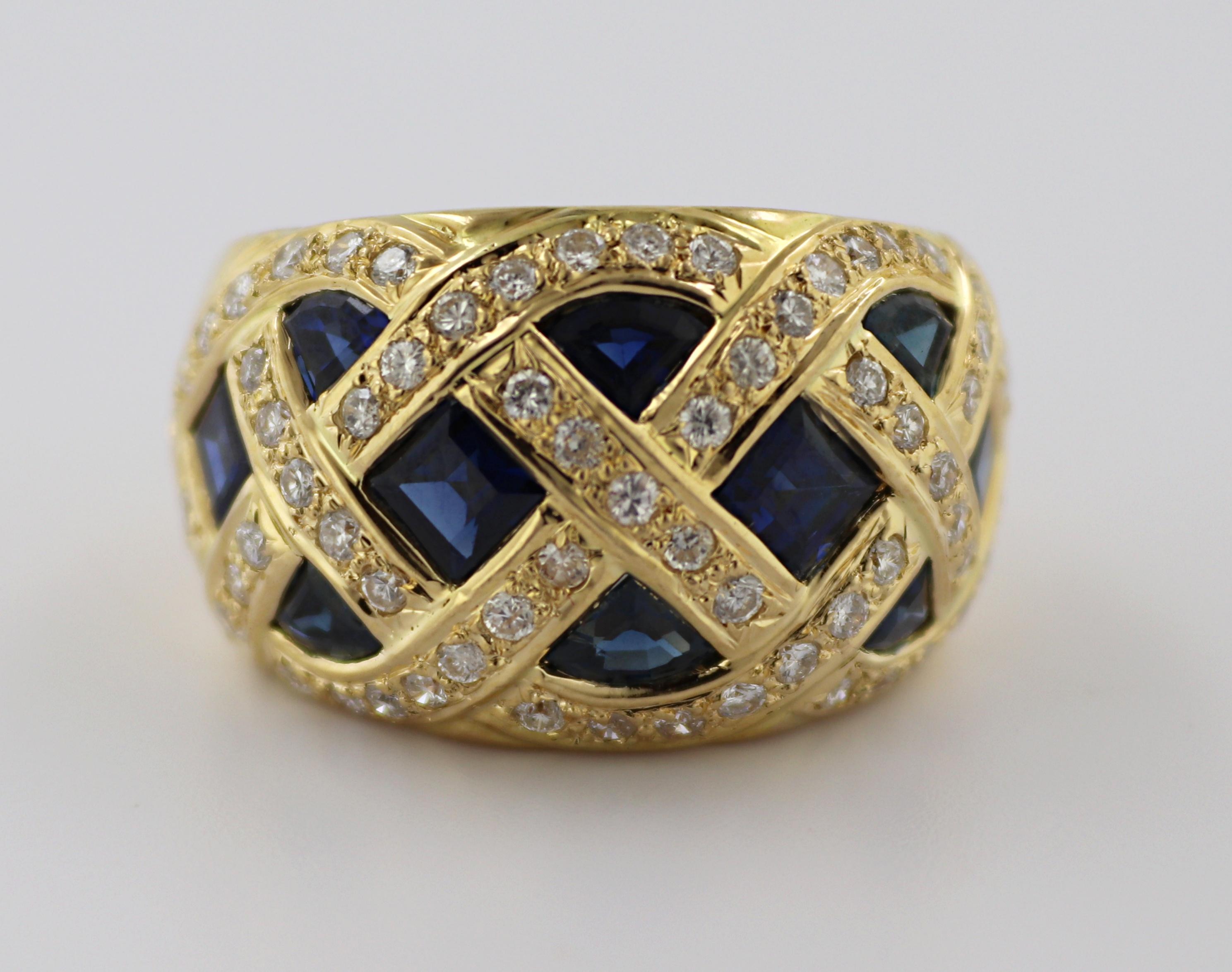 Featuring (10) calibre-cut sapphires, 3.41 cts. tw., accented by (66) full-cut diamonds, 0.88 ct. tw., SI-I, I-
J, set in an 18k yellow gold basket weave style mounting, tapering from 15.2 mm to 7.2 mm, size 8.5,
marked S341, D088, 18K Gross weight