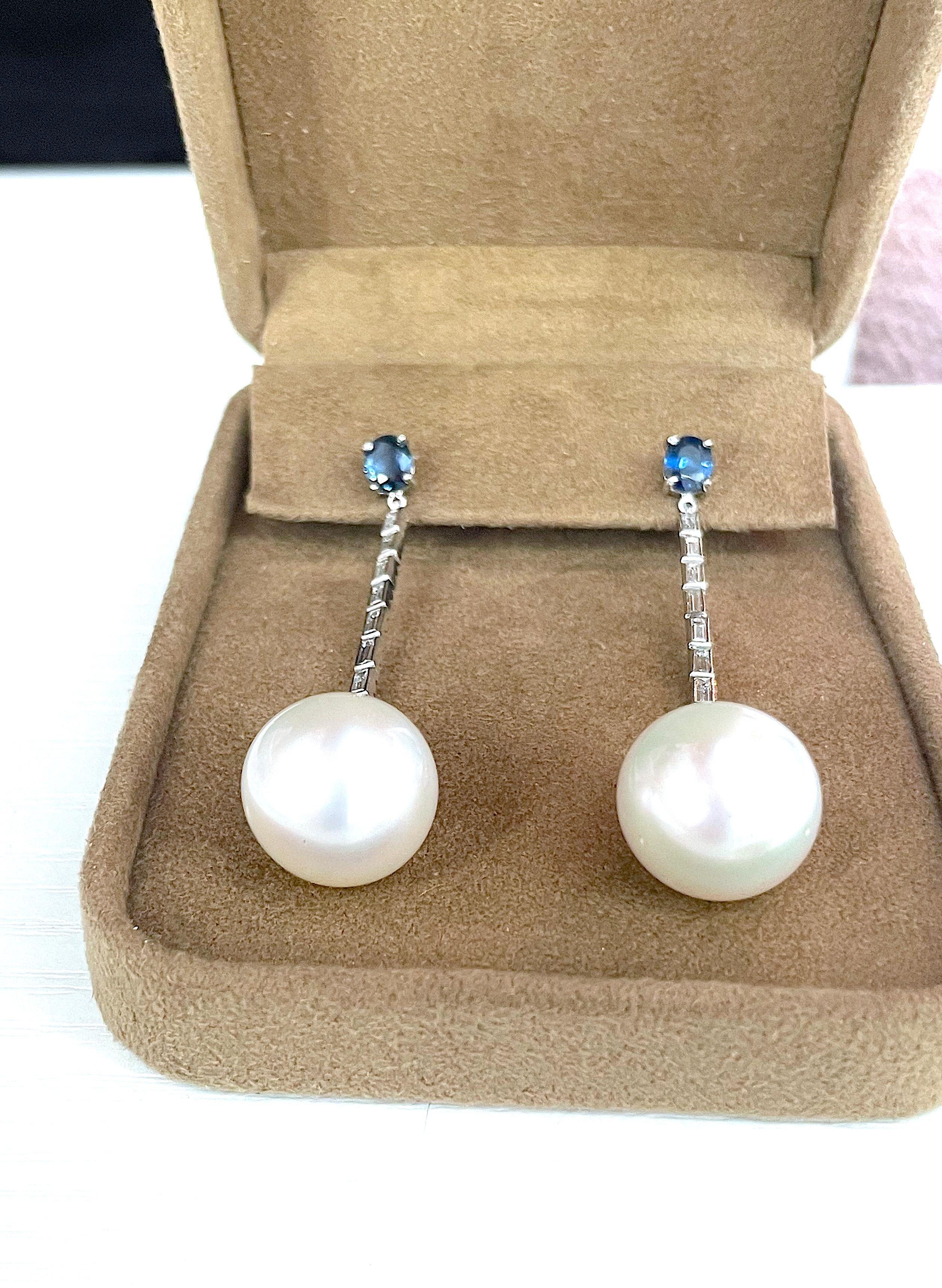 Sapphire Diamond and Pearl Drop Earring A. Clunn

Beautiful Pearl drop evening earring by Andrew Clunn. 

This elegant earring with Sapphire Stud approximately ~0.75cts each and baguette diamond line approximately ~1.50cts finished with 15mm South