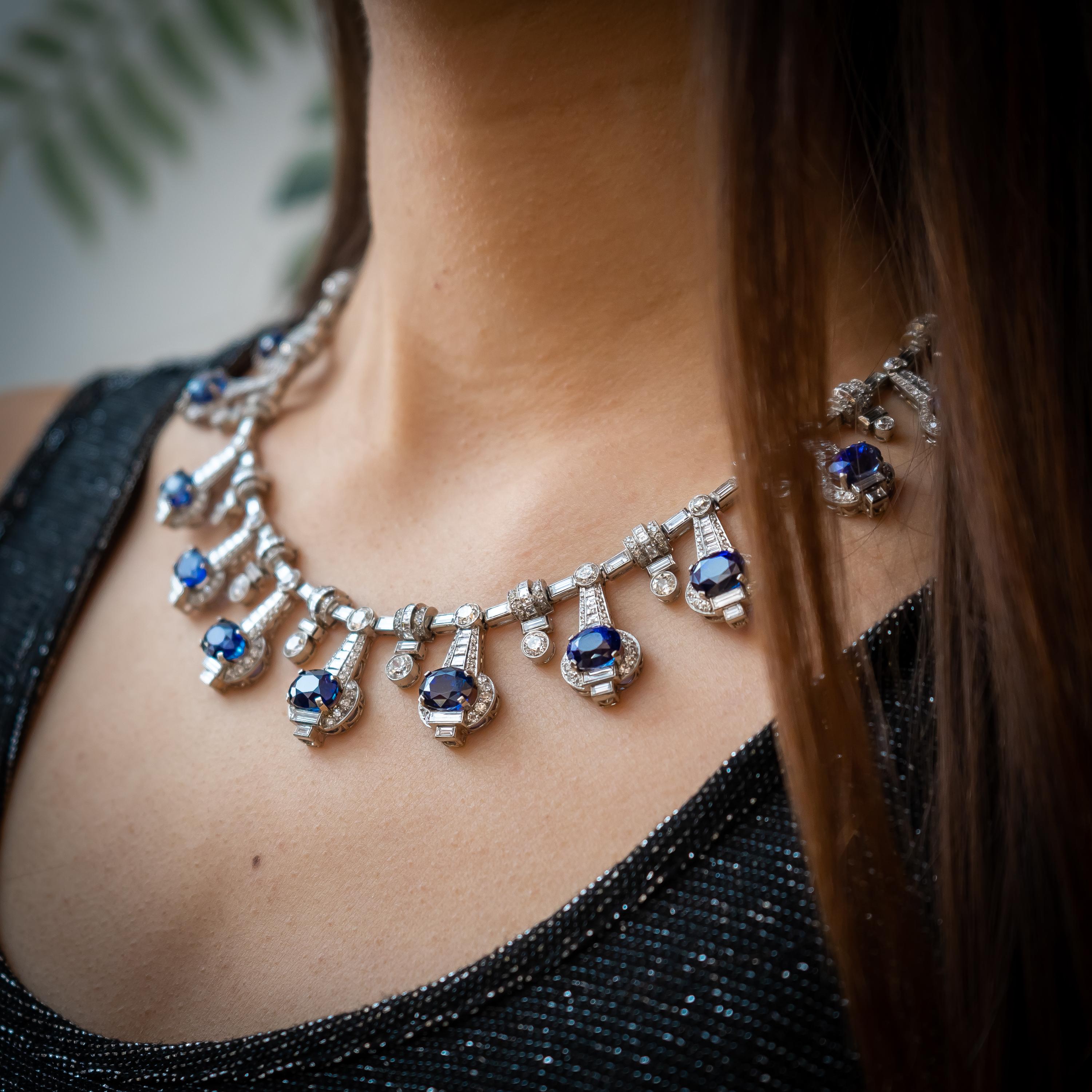 A fine, modern, sapphire and diamond fringe necklace, set with oval faceted sapphires, weighing an estimated total of 33.40ct, in diamond set drops, with round brilliant-cut and baguette-cut diamonds, with an estimated total diamond weight of