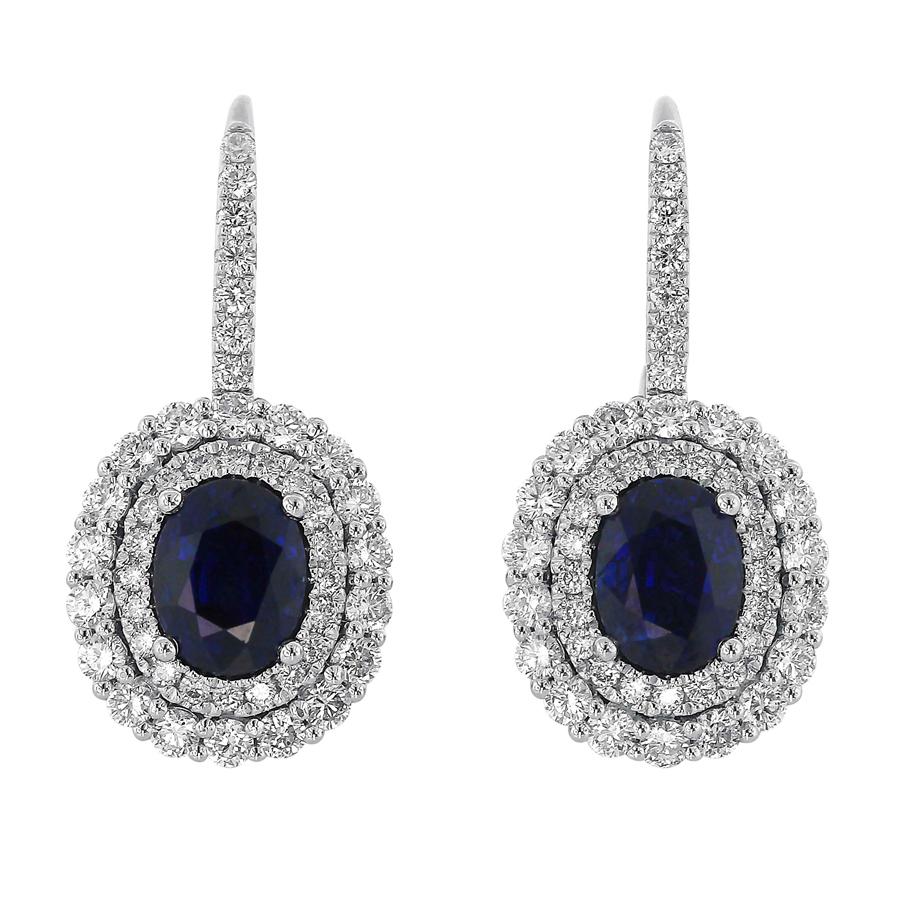 Easy to dress up or down, these versatile and comfortable earrings feature deep blue sapphires offset by double halos formed from sparkling diamonds. Additional diamonds accent the earring mountings, emphasising the delicacy of the drops.
