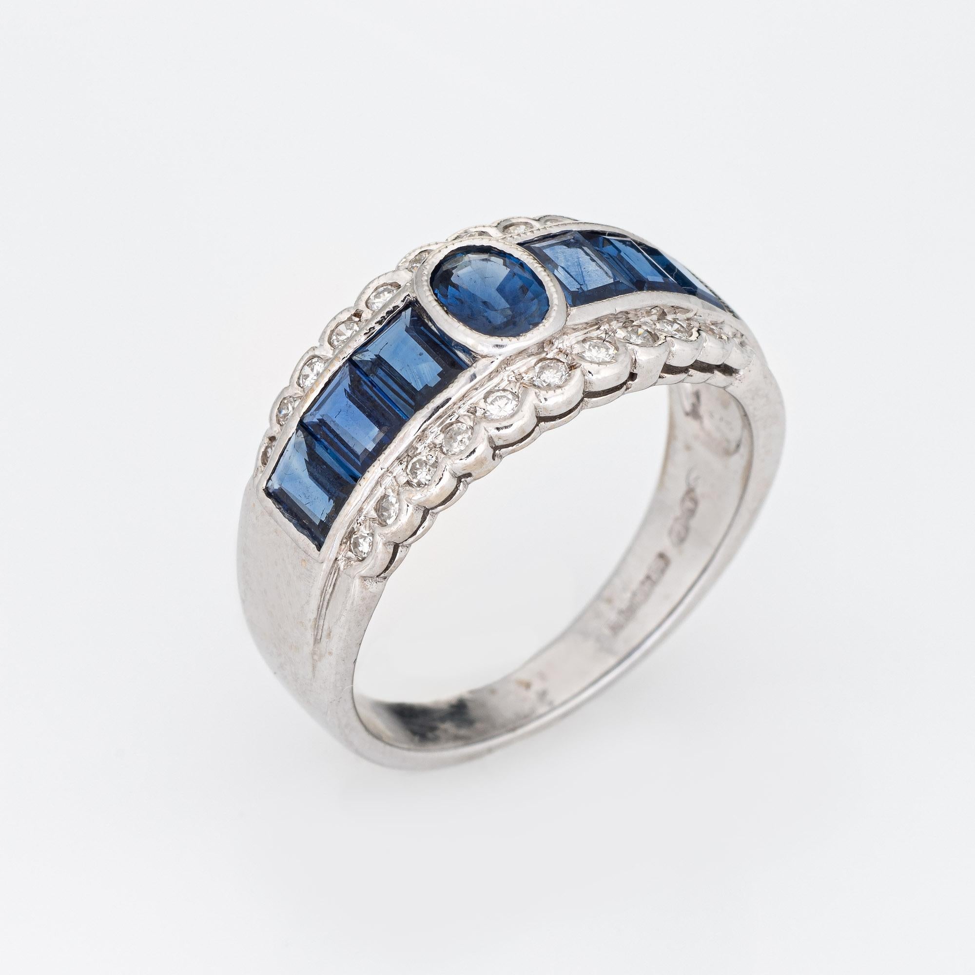 Stylish sapphire & diamond band crafted in 18 karat white gold. 

Sapphires total an estimated 1.50 carats, accented with an estimated 0.20 carats of diamonds (estimated at H-I color and VS2-SI1 clarity). The sapphires are in very good condition and