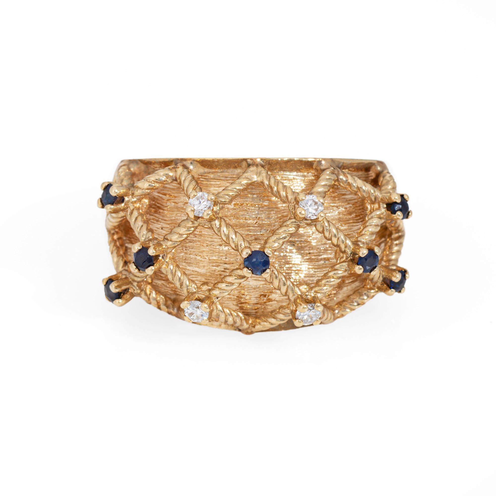 Stylish vintage sapphire & diamond basket weave ring (circa 1970s to 1980s) crafted in 14 karat yellow gold. 

Four diamonds total an estimated 0.02  carats (estimated at I-J color and SI1-2 clarity). 7 sapphires total an estimated 0.04 carats. 
