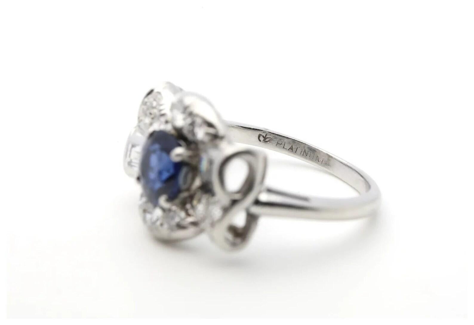 Round Cut Sapphire & Diamond Bow Motif Ring in Platinum by Maurice Tishman