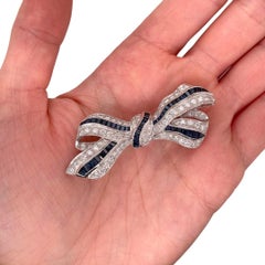 Sapphire & Diamond Bow Ribbon Brooch in 18K White Gold