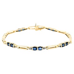 Bracciale con zaffiri e diamanti in oro giallo 14k