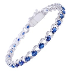 Sapphire Diamond Bracelet in 18 Karat Gold Weighing 10.12 Grams in 0.45 Carat