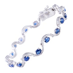 Sapphire Diamond Bracelet in 18 Karat Gold Weighing 10.54 Grams in 0.74 Carat