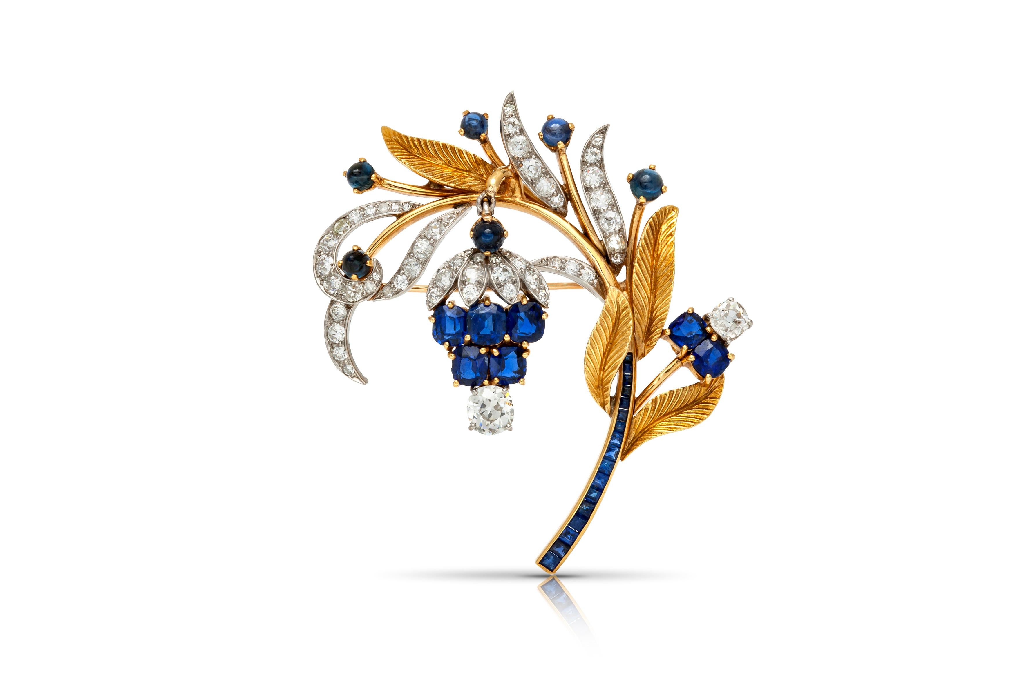 Brooch, finely crafted in 18k yellow gold and platinum with sapphires weighting approximately a total of 10.00 carats and diamonds weighting approximately a total of 4.00 carats. Circa 1940's.