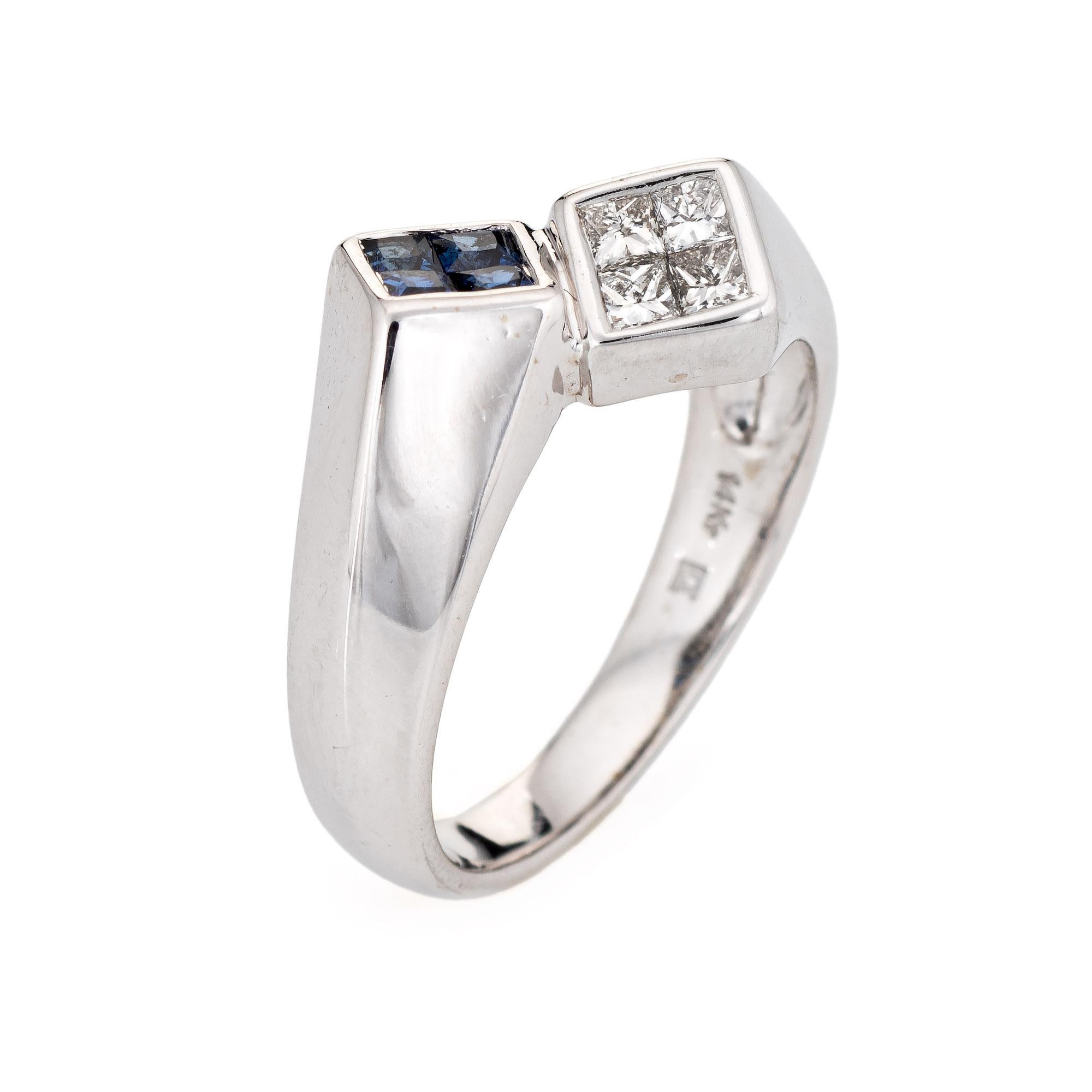 Stylish vintage sapphire & diamond bypass ring crafted in 14 karat white gold gold. 

Princess cut diamonds total an estimated 0.20 carats (estimated at G-H color and VS2-SI1 clarity). Princess cut sapphires total an estimated 0.20 carats. The