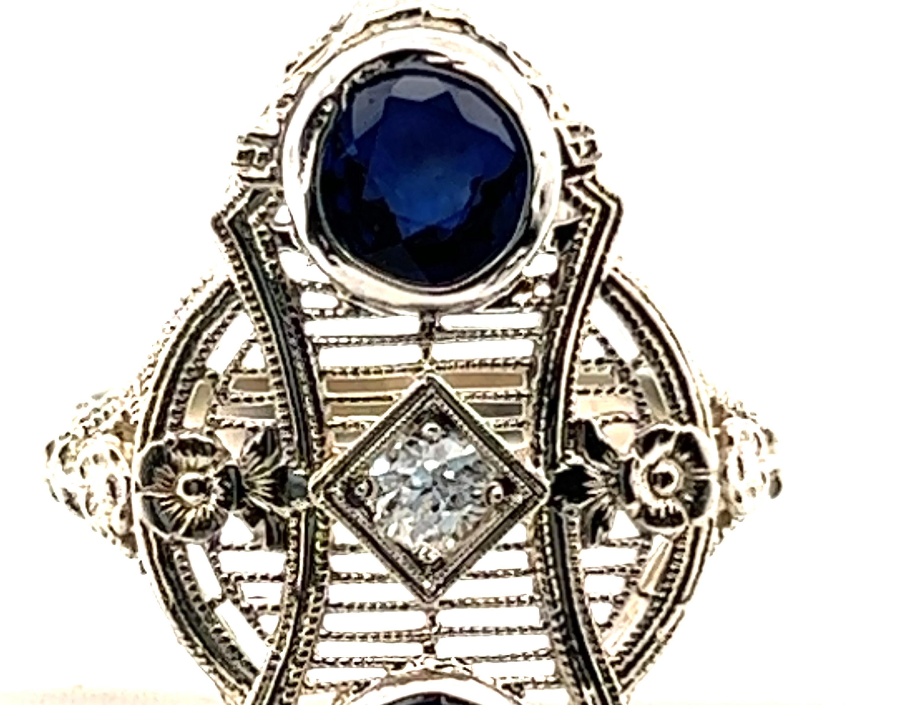 Genuine Original Antique from 1920s Sapphire Diamond Cocktail Ring 1.41ct Antique Art Deco Flowers 14k


Centering on a Natural Mined .10 Carat Old European Cut Diamond Center

Two Large (Over 1/2 Carat Each) Rich Royal Blue Bezel Set