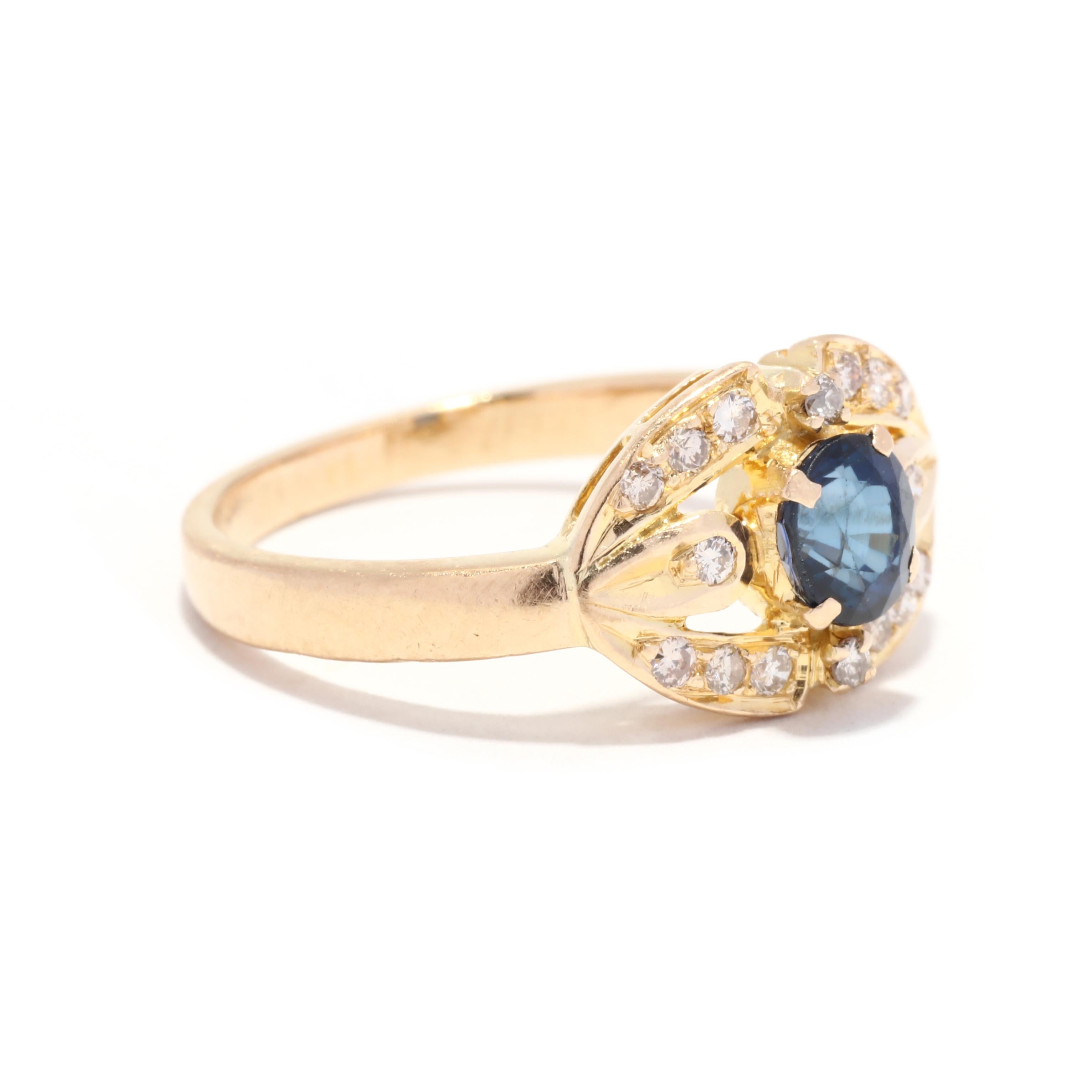 A vintage 18 karat yellow gold sapphire and diamond cocktail ring. This September birthstone ring features a prong set, oval cut sapphire weighing approximately .50 carat set in an open horizontal navette shape mounting set with round brilliant cut