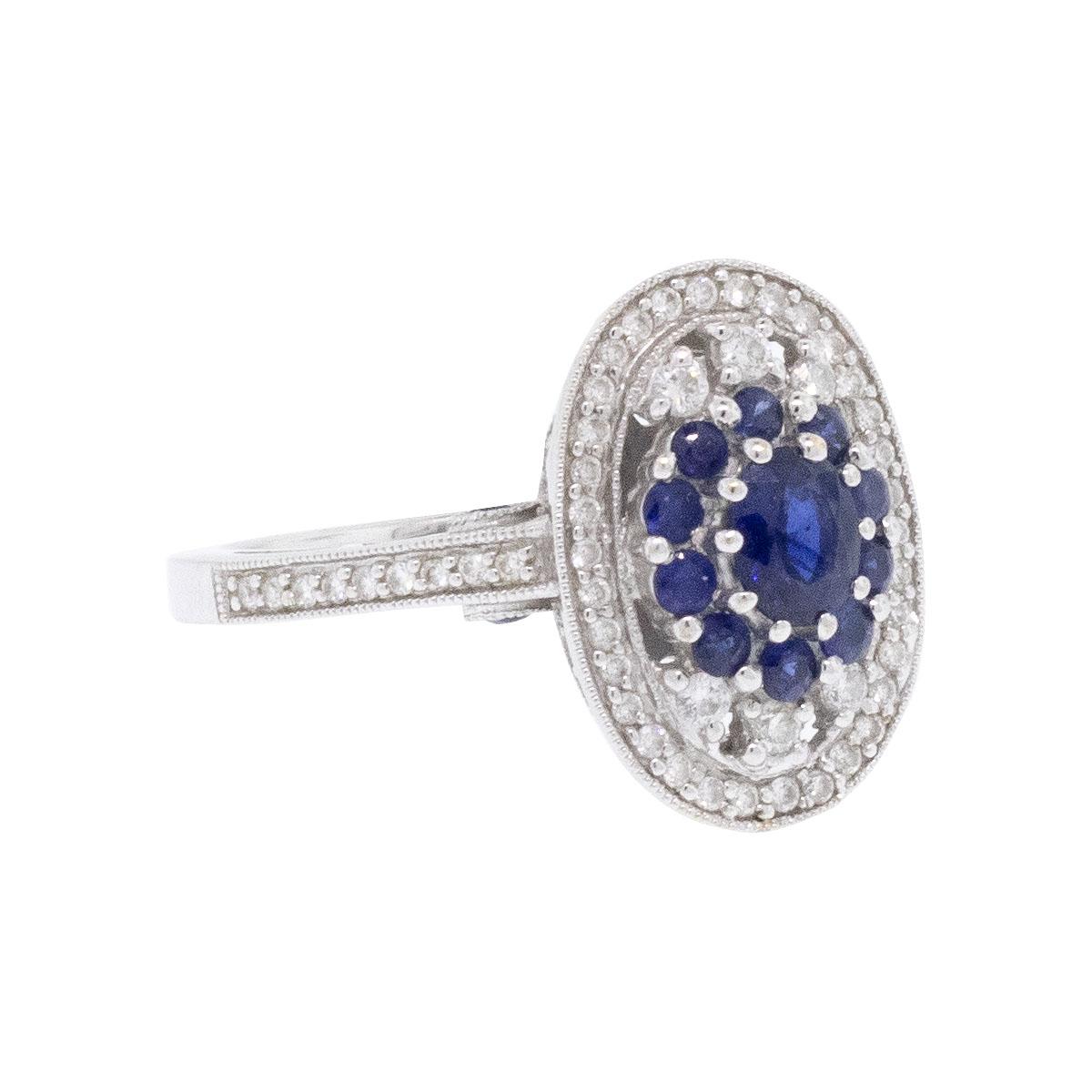 Elevate your style with this exquisite 18k White Gold Sapphire & Diamond Cocktail Ring. Crafted from luxurious 18k white gold, this gemstone cocktail ring features a stunning combination of white diamonds and sapphire gemstones, adding a touch of