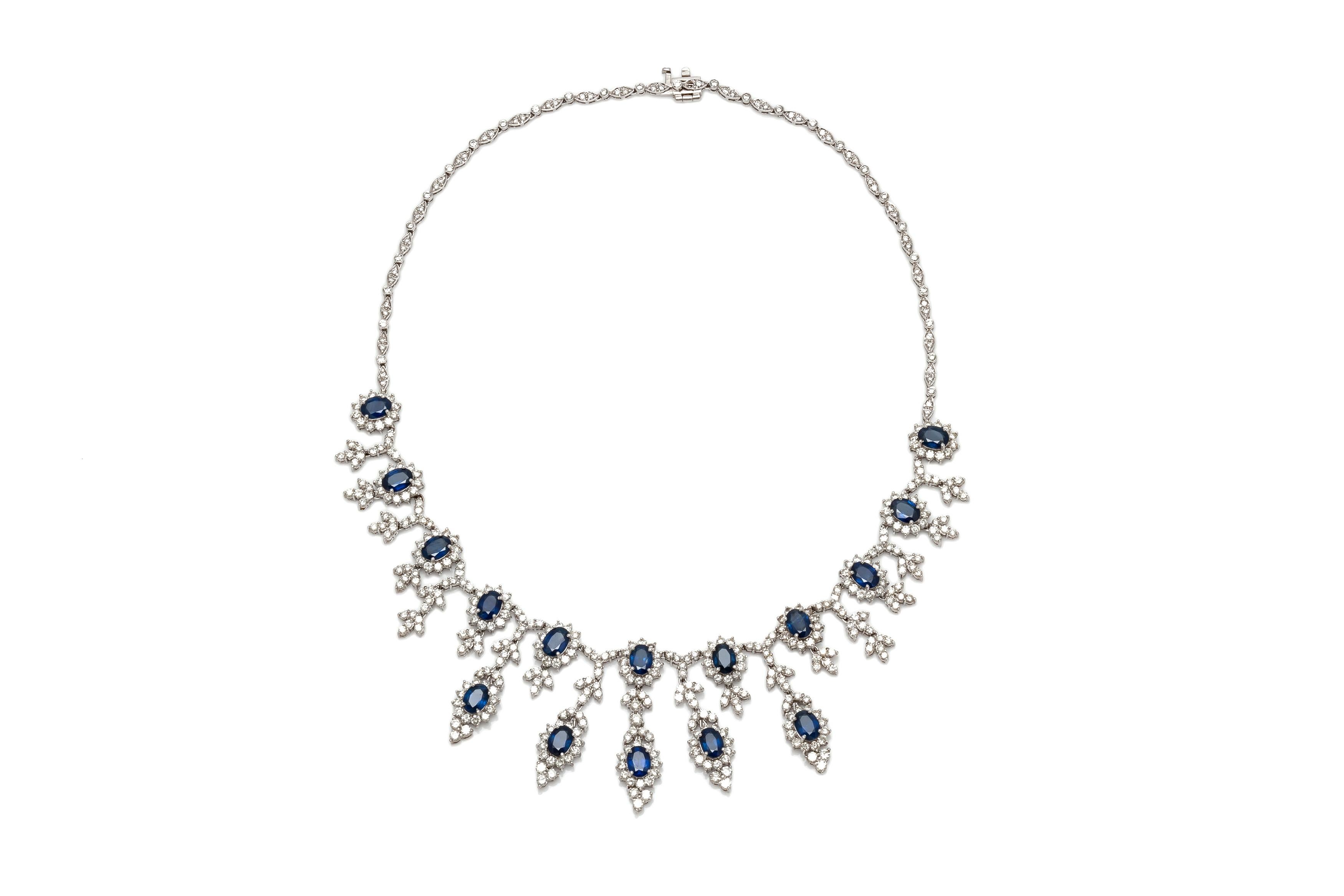 Necklace, finely crafted in 18k white gold with diamonds weighing a total of 16.52 carats and sapphires weighing a total of 16.58 carats. Circa 1990's.
