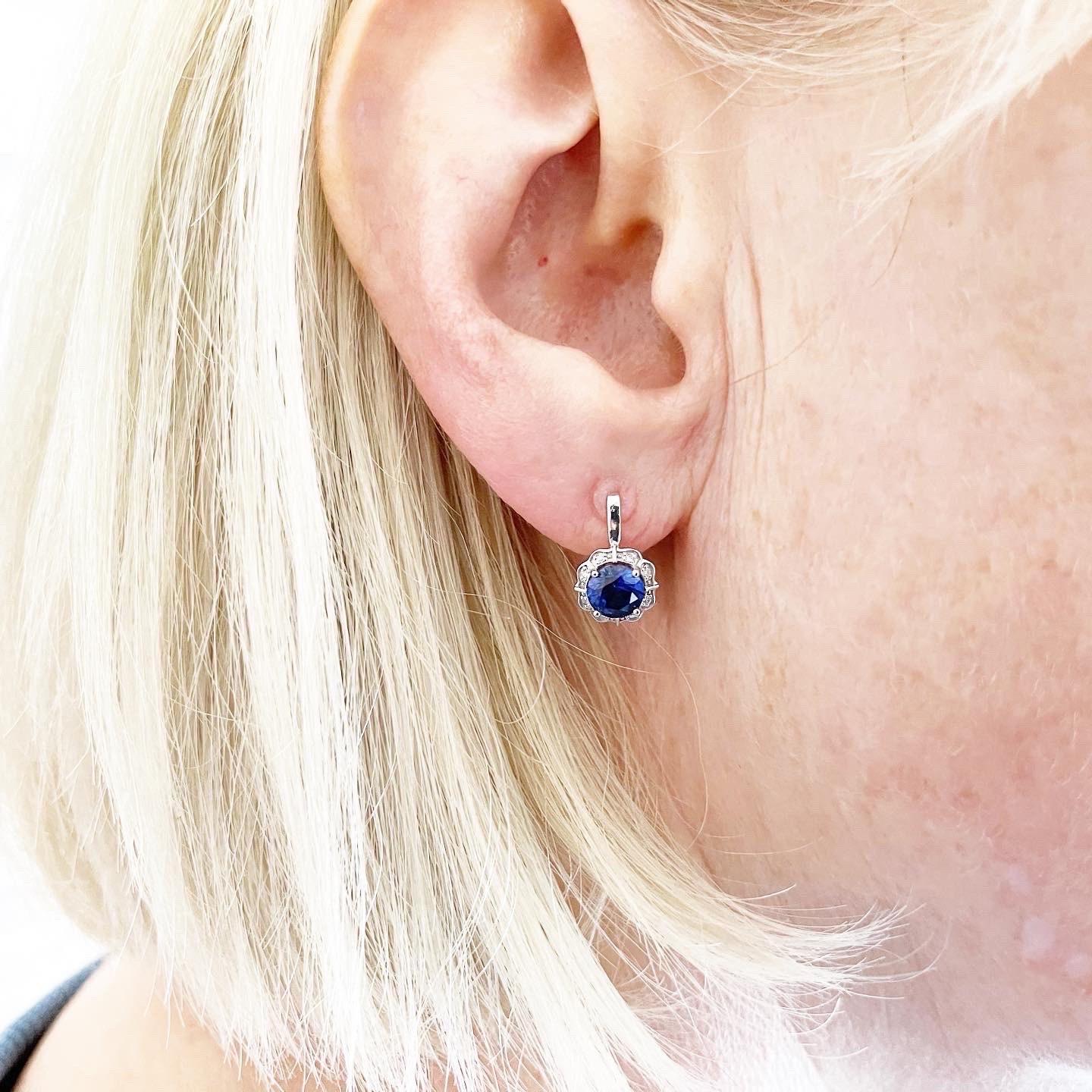 These are absolutely stunning! So beautiful on ears made with natural blue sapphire and diamonds in a floral design, the sapphires are approximately 5mm. The gold is two tone at 18KT. 

*Item will come with a beautiful packaging and certificate of