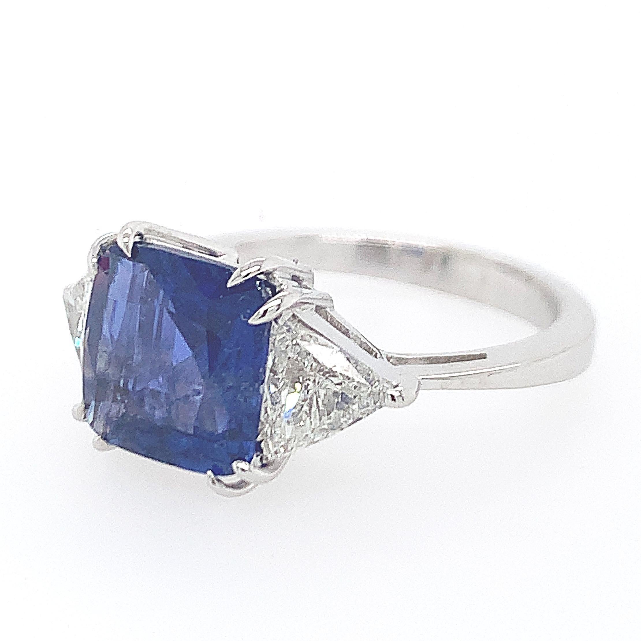 18K Y/gold Sapphire Diamond Engagement Ring, sapphire weighing approx. 3.00 cts, flanked by two trillon cut diamonds weighing approx. 0.65 cts, GH VS, stamps 750, ring size 7, weight 3.3 dwt