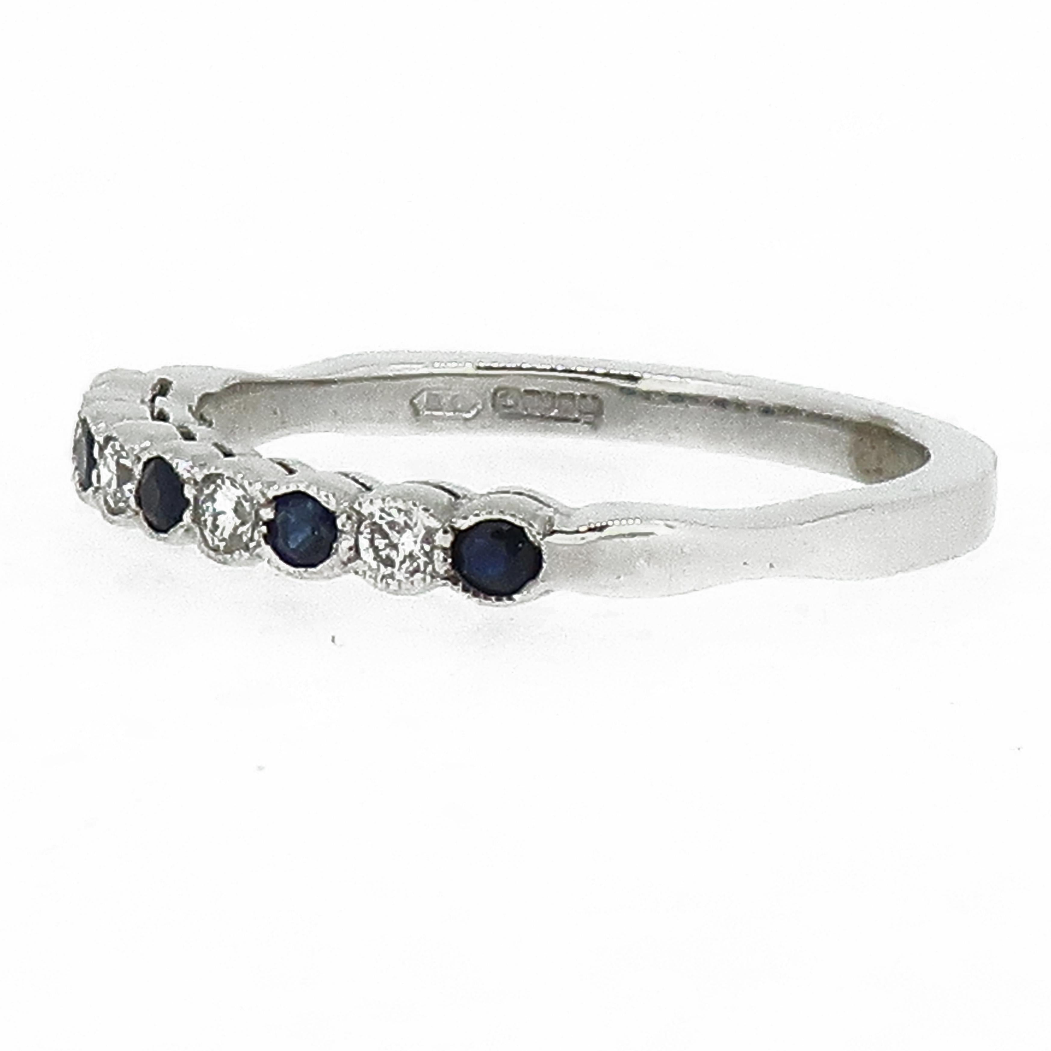 Sapphire & Diamond Eternity Band Ring 18 Karat White Gold

A dainty diamond eternity ring. Consisting of five round blue sapphires and four white brilliant cut diamonds. All set in a delicate mill-grain setting in 18 carat white gold. It would make