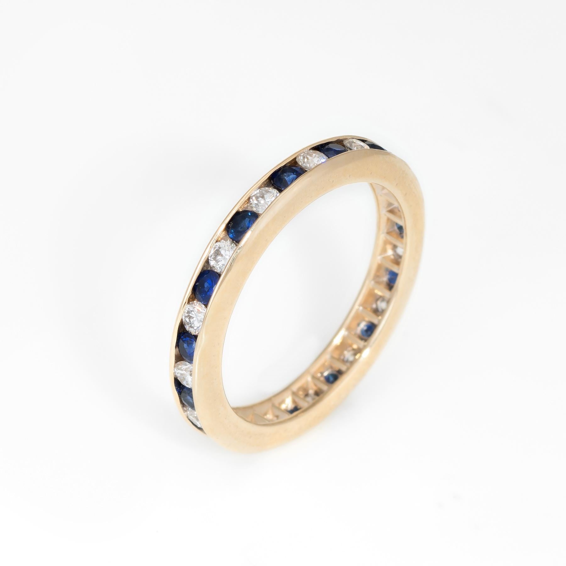 Elegant estate eternity ring, crafted in 14 karat gold. 

15 full cut diamonds total an estimated 0.30 carats (estimated at H-I color and VS2-SI1 clarity), accented with an estimated 0.30 carats of sapphires. 

The ring is in excellent condition.