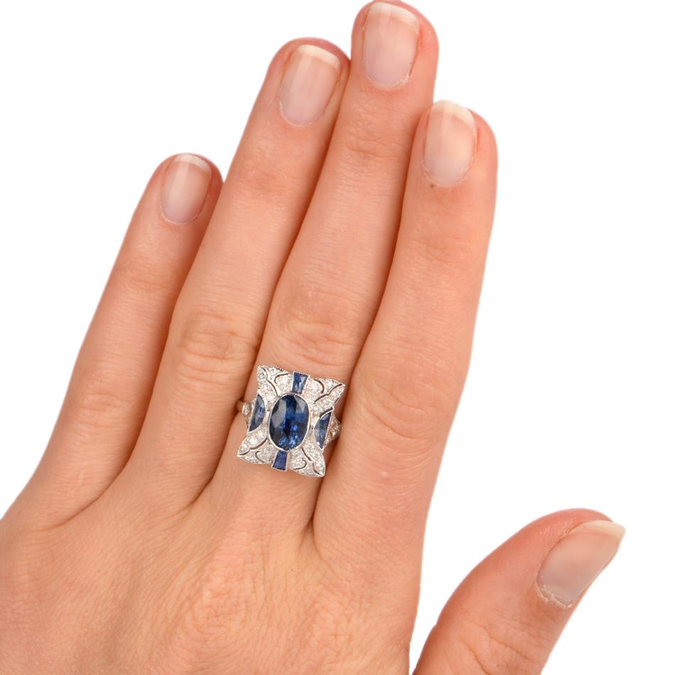 This elegant sapphire cocktail ring is crafted in solid 18-karat white gold, weighing 5.6 grams and measuring 16mm x 6mm high. Simulating a rectangle cushion frame, pave set with 30 round cut diamonds collectively weighing approximately, 0.45