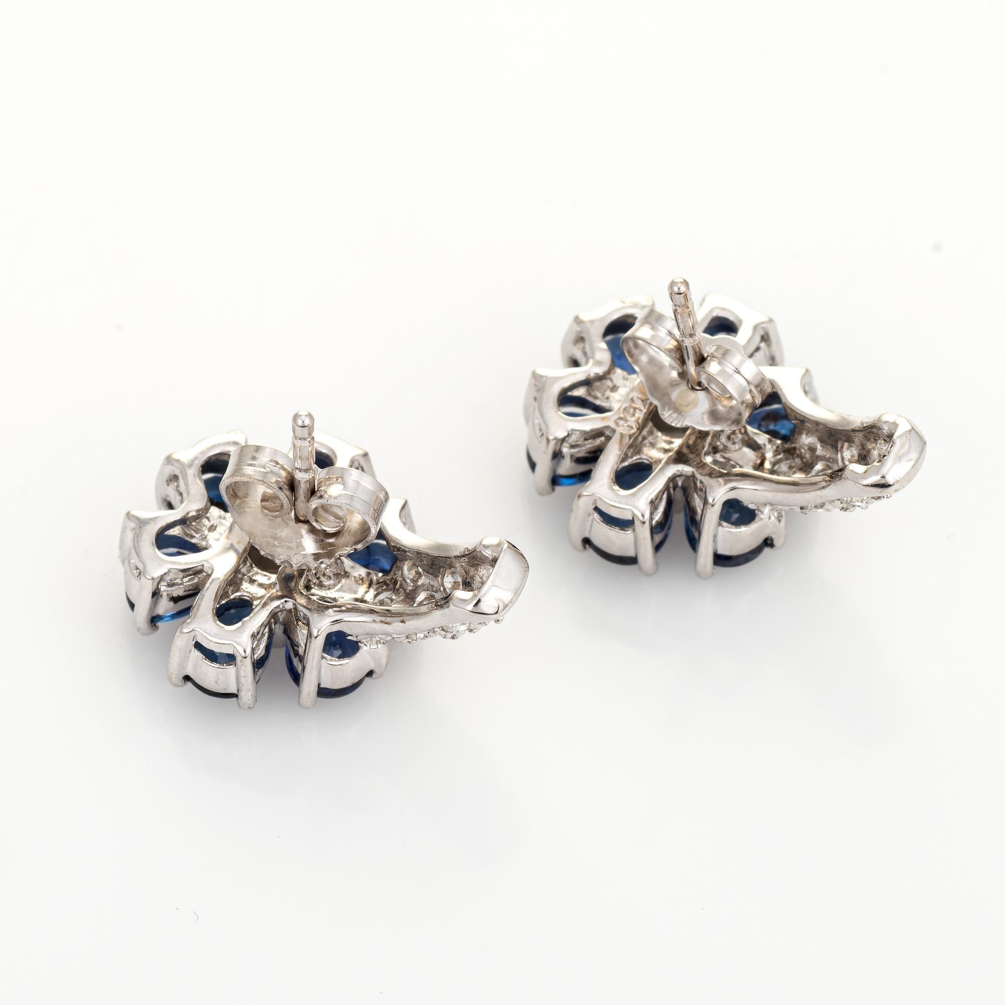 Elegant pair of blue sapphire & diamond shrimp earrings crafted in 18k white gold (circa 2000s). 

Faceted pear cut sapphires total an estimated 2.40 carats. Diamonds total an estimated 0.50 carats (estimated at H-I color and VS2-SI2 clarity). The