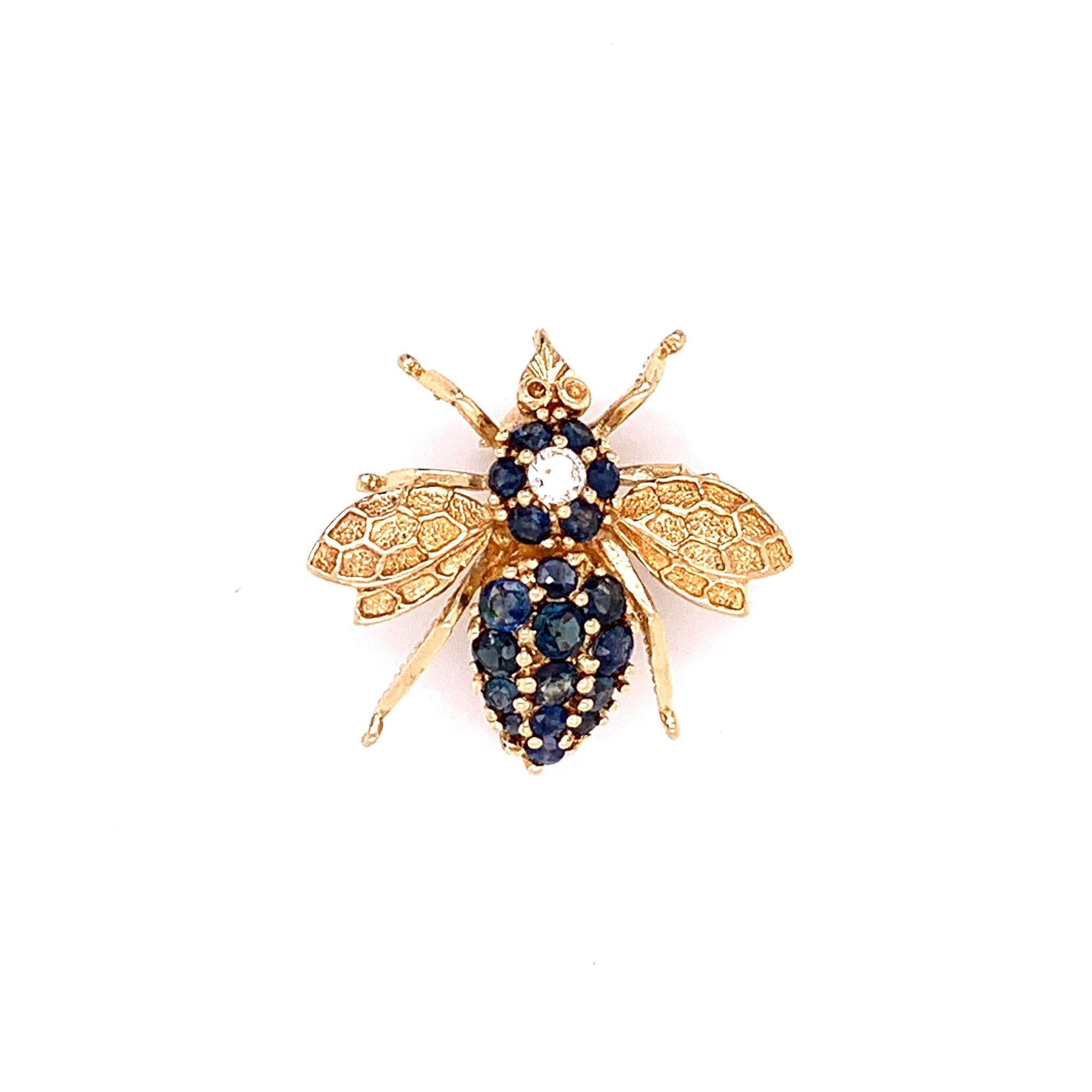 A lovely little bumblebee you will not mid landing on your shirt. This pin features round cut blue sapphire along with 1 large round cut diamond set in 14k yellow gold. A great addition to any outfit, lightweight and easy to wear.

Dimensions: 0.90