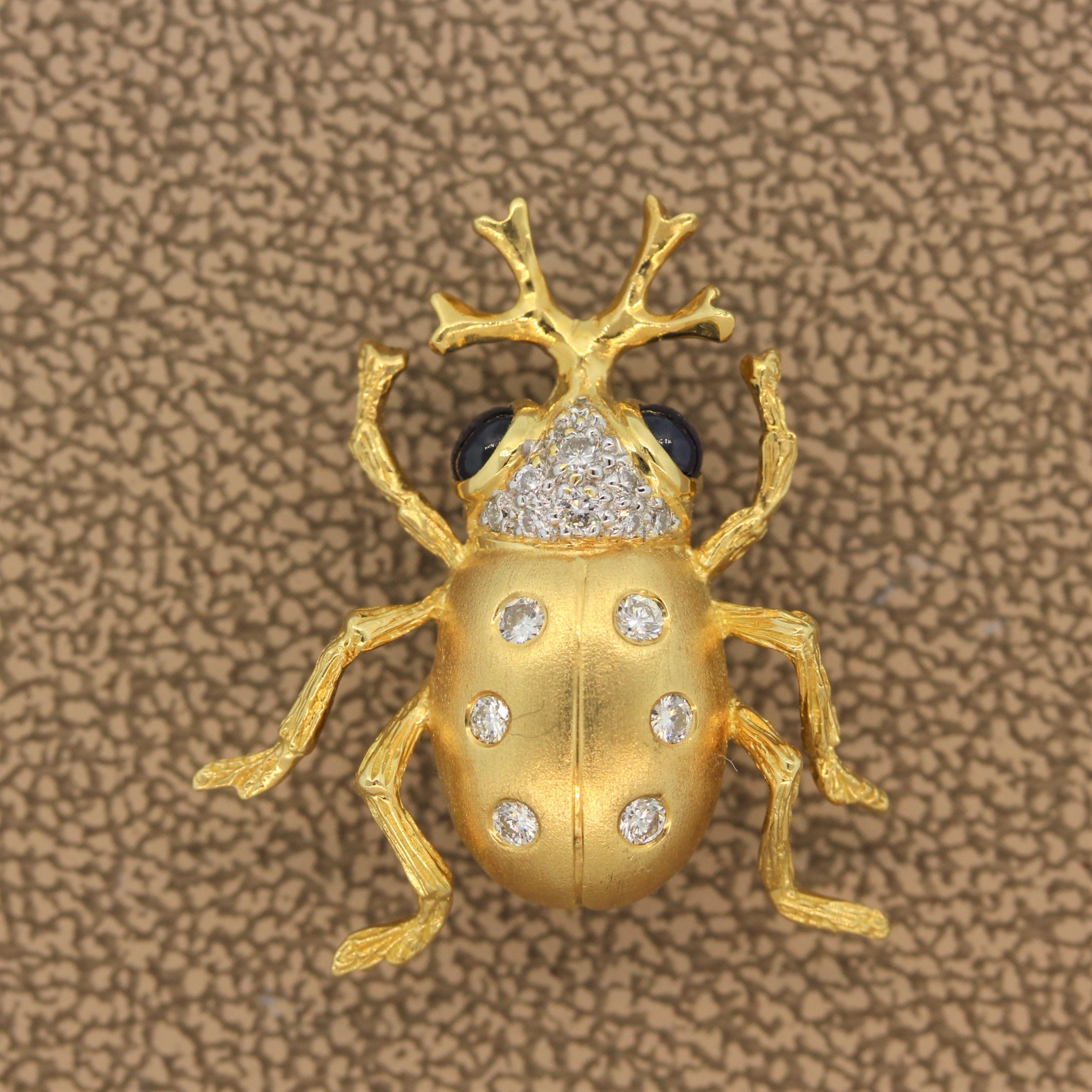 This fast crawling beetle brooch complete with horns features 0.43 carats of blue sapphire cabochon eyes. The 18K yellow gold body is polka dotted with 0.25 carats of sparkling colorless round cut diamonds.

Brooch Length: 1.00 inch
Brooch Width: