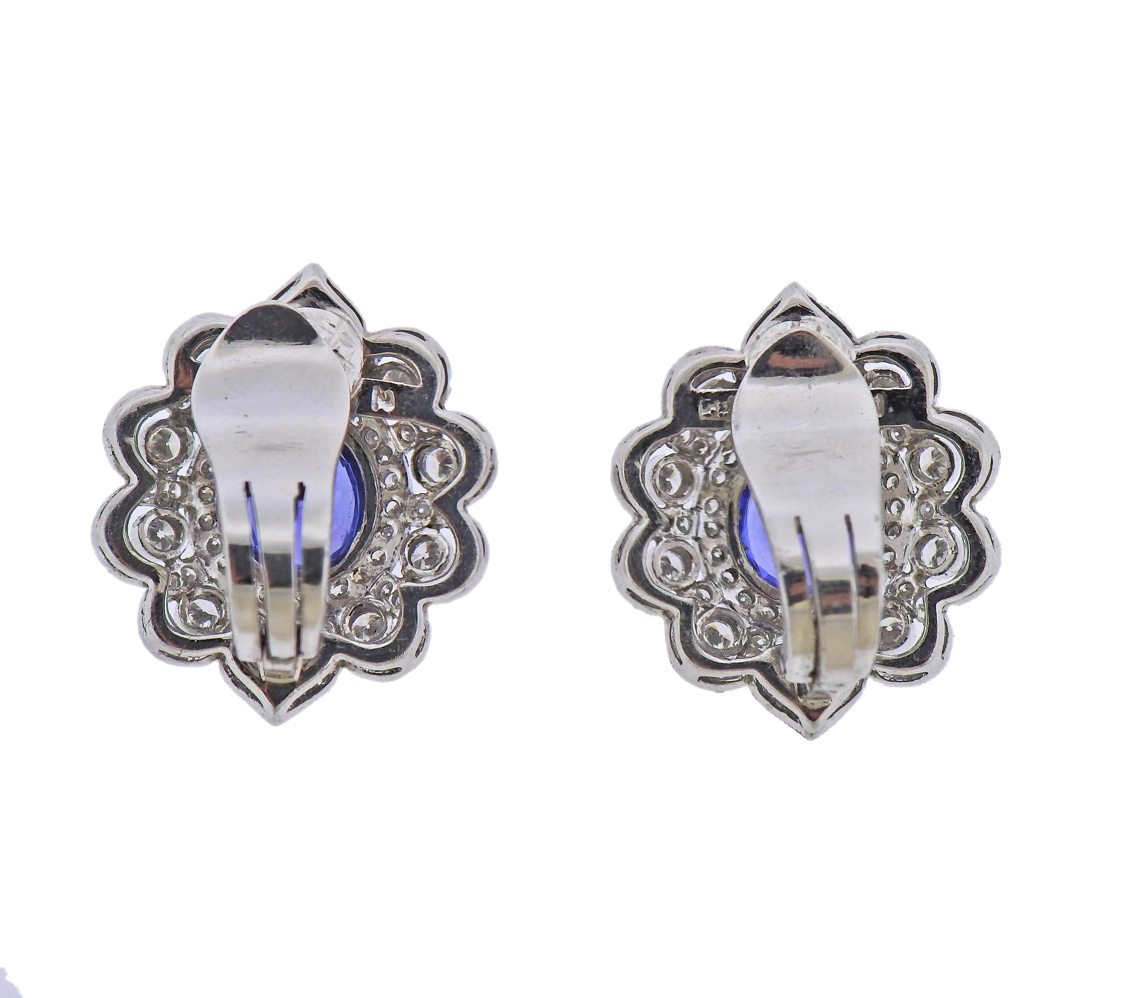Pair of 14k white gold earring, set with blue sapphires and approx. 1.40ctw in diamonds. Earrings measure 22mm x 20mm. Marked 585, N. Weigh - 10 grams.