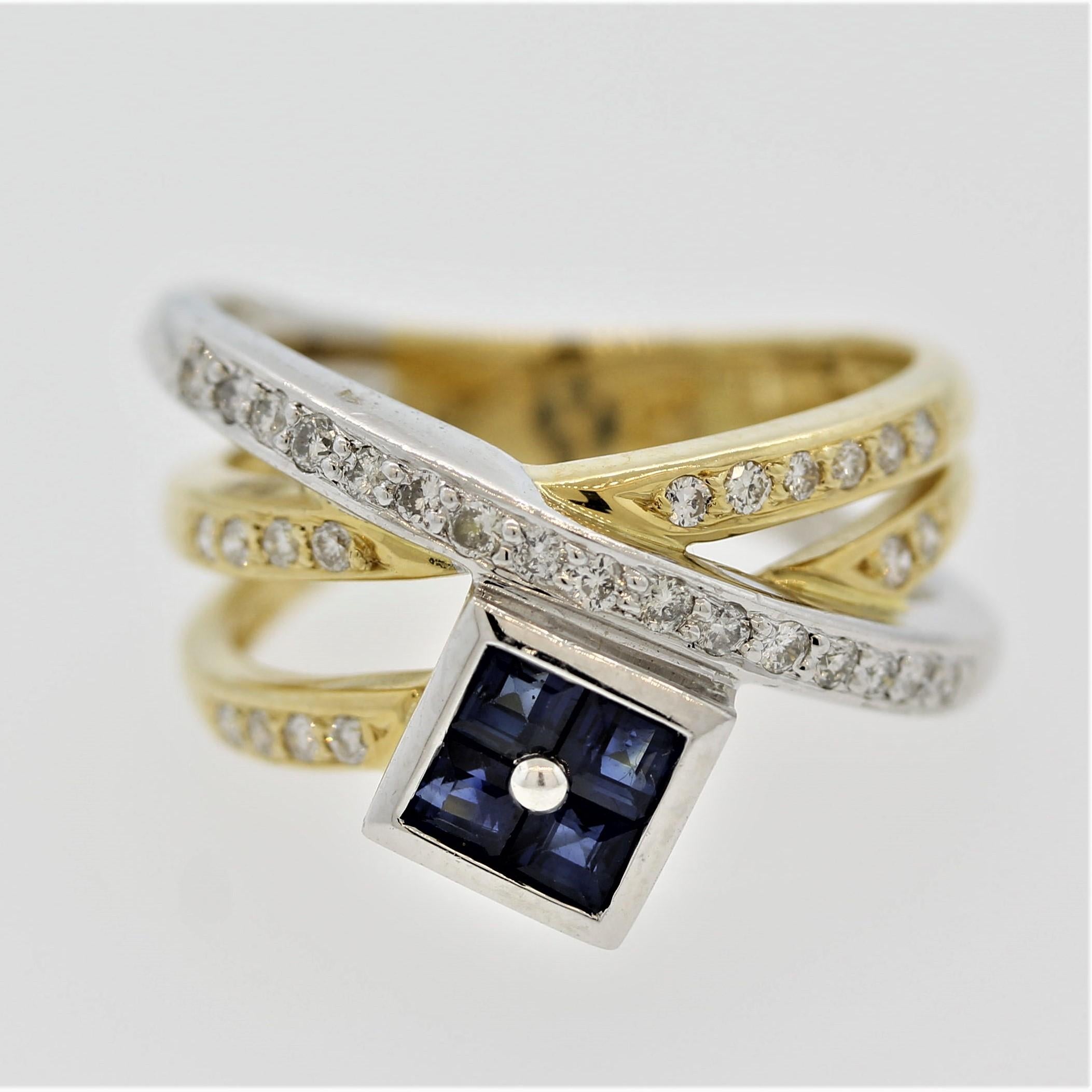 Ein einzigartiger Crossover-Ring mit 0,40 Karat blauen Saphiren im Quadratschliff. Er wird von 0,32 Karat runden Diamanten im Brillantschliff akzentuiert, die auf den Kreuzungen gefasst sind. Hergestellt aus 18 Karat Gelbgold und Platin.

Ring Größe